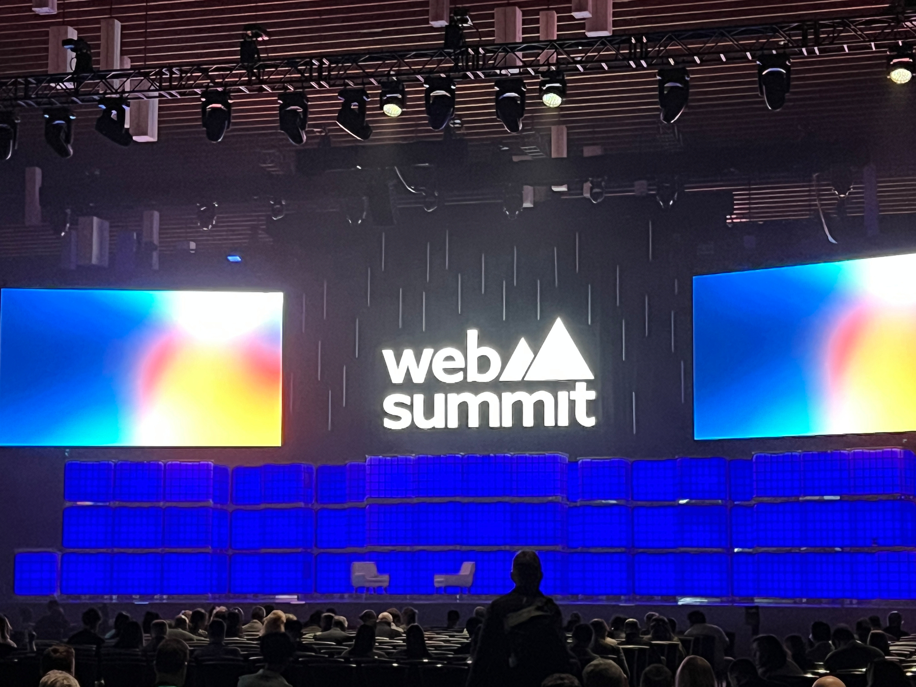 Main stage at WebSummit with lots of lights and colours