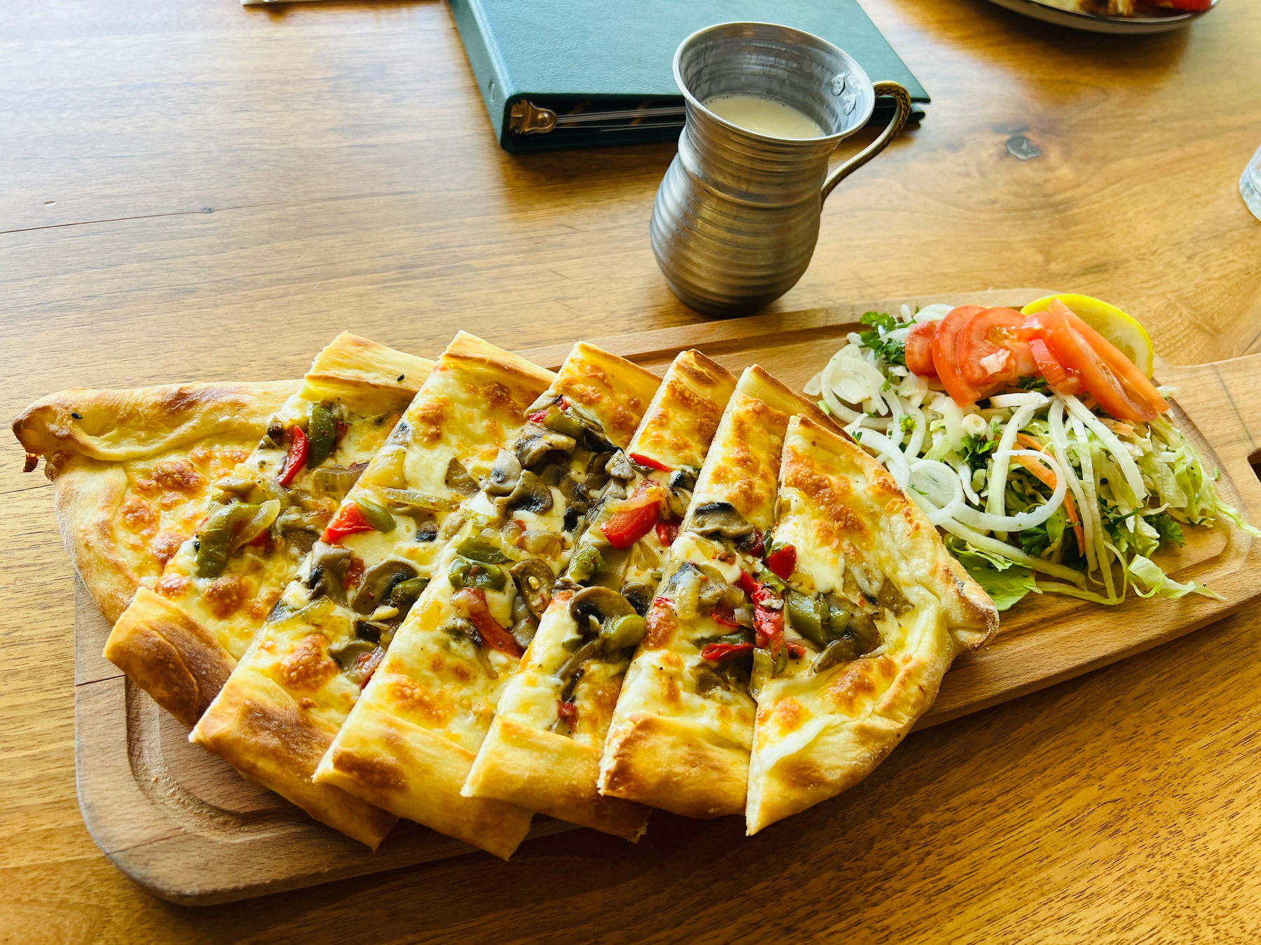 Turkish pide and mug of ayran 