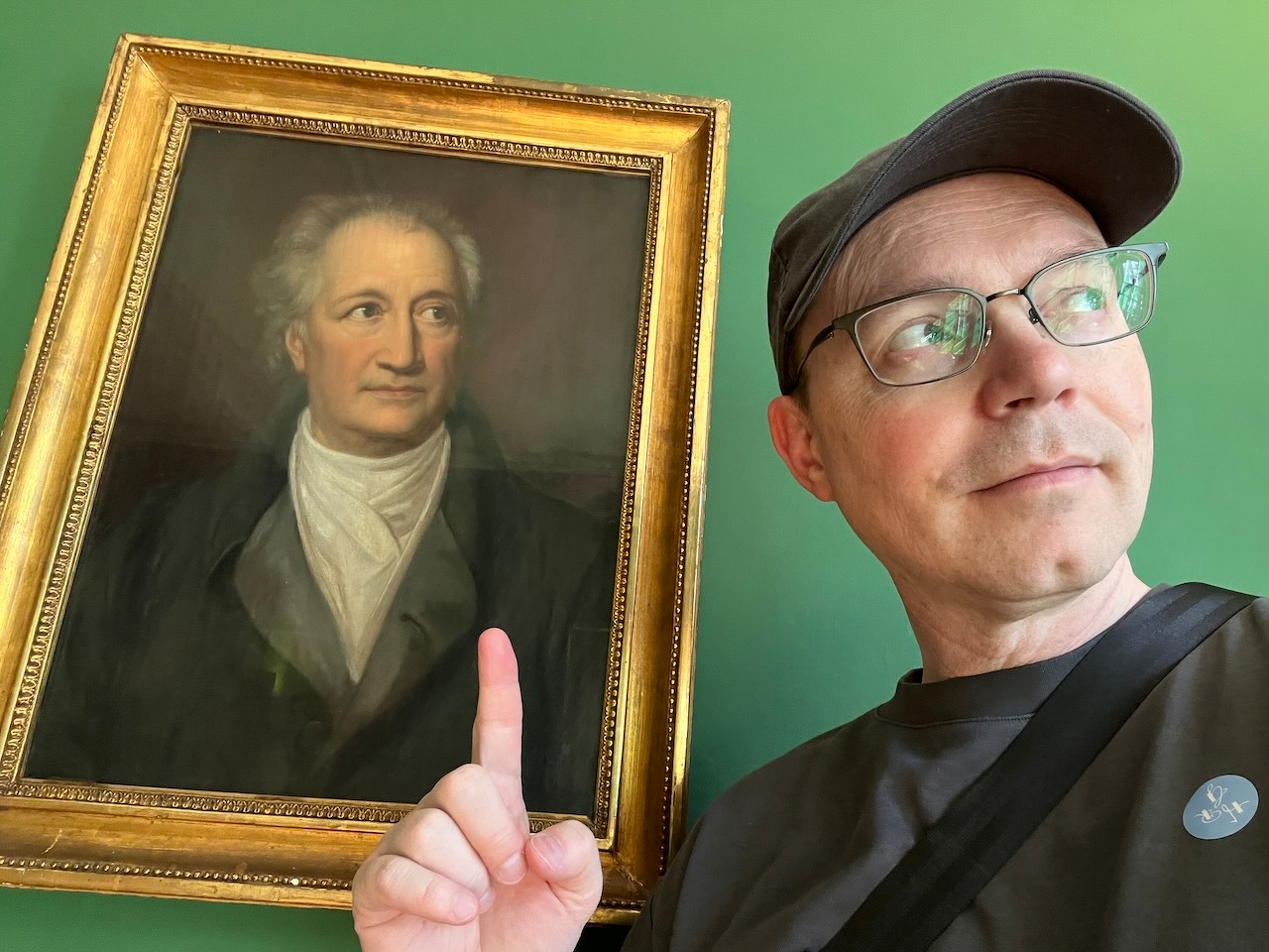 Chad posing with a portrait of Goethe later in his life