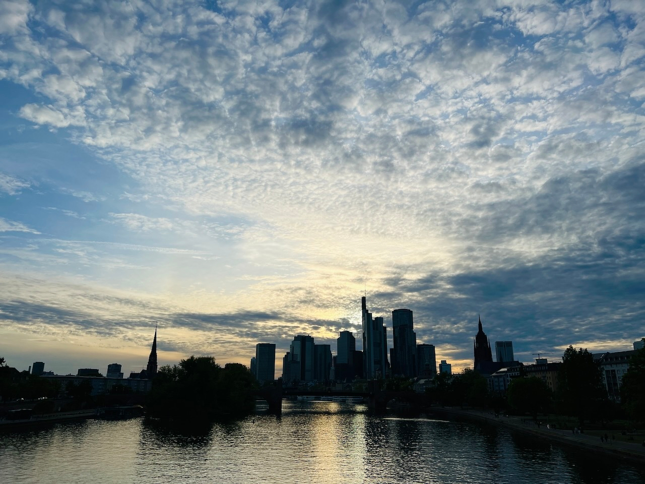 Skyline of Frankfurt from the river as the sun goes down