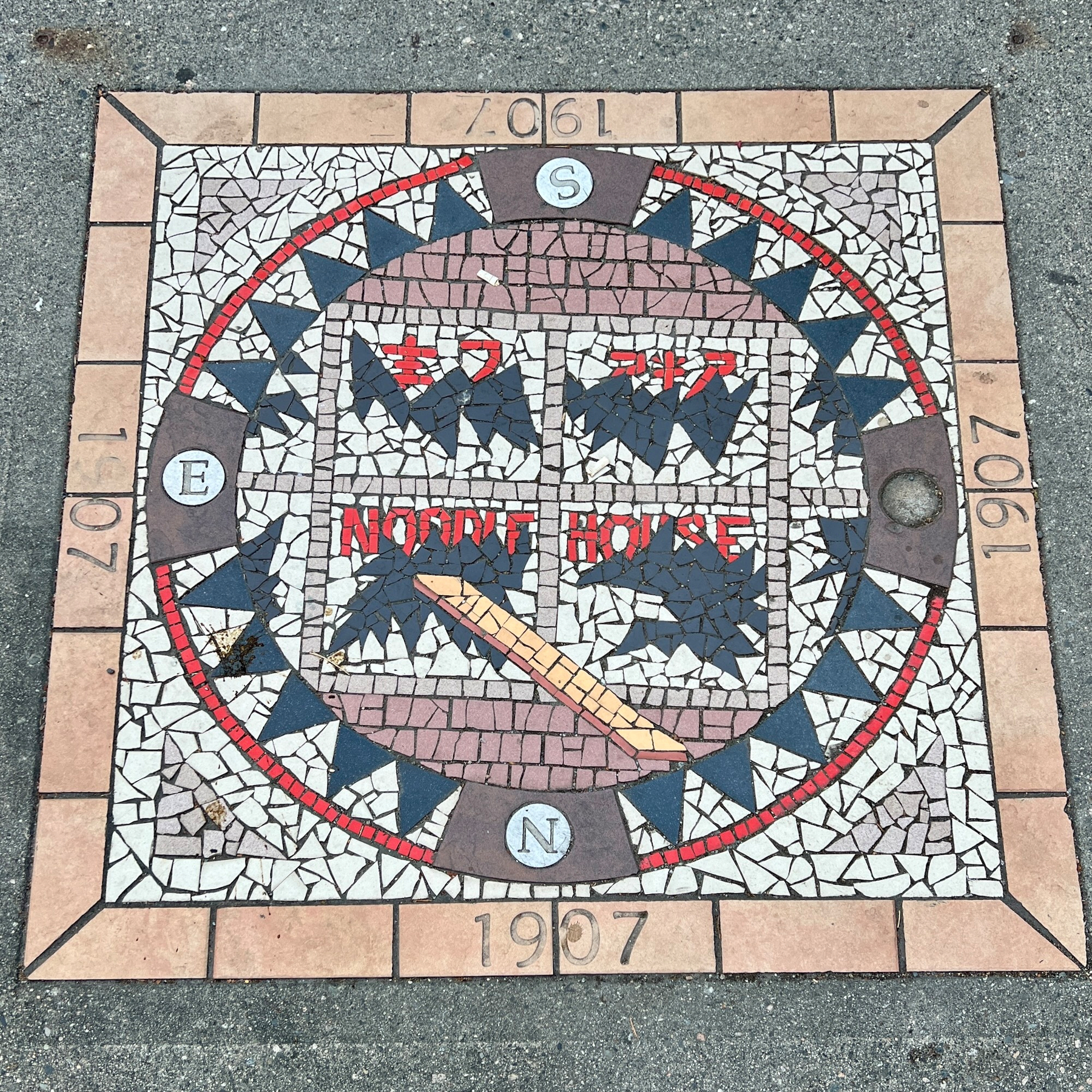 Mosiac symbolizing the 1907 race riots with an image of the smashed windows of a noodle house
