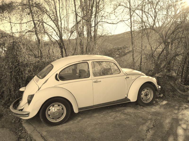 Old white Volkswagen. Sepia filter used.