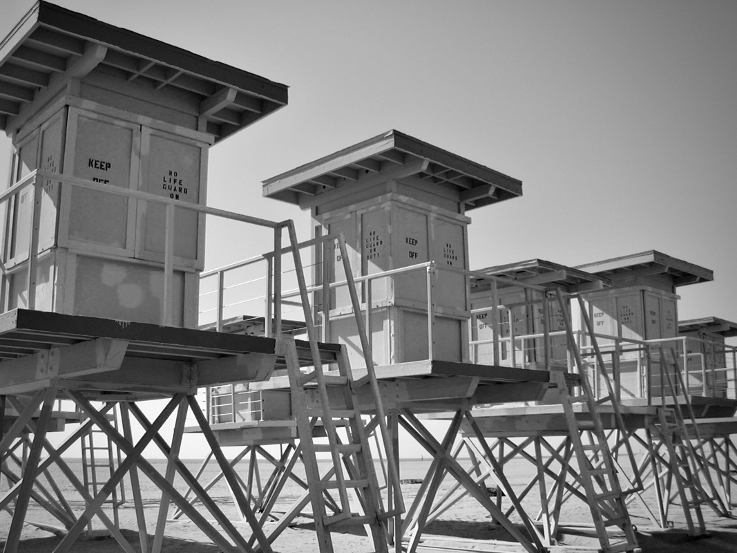 Lifeguard towers in storage for the winter.