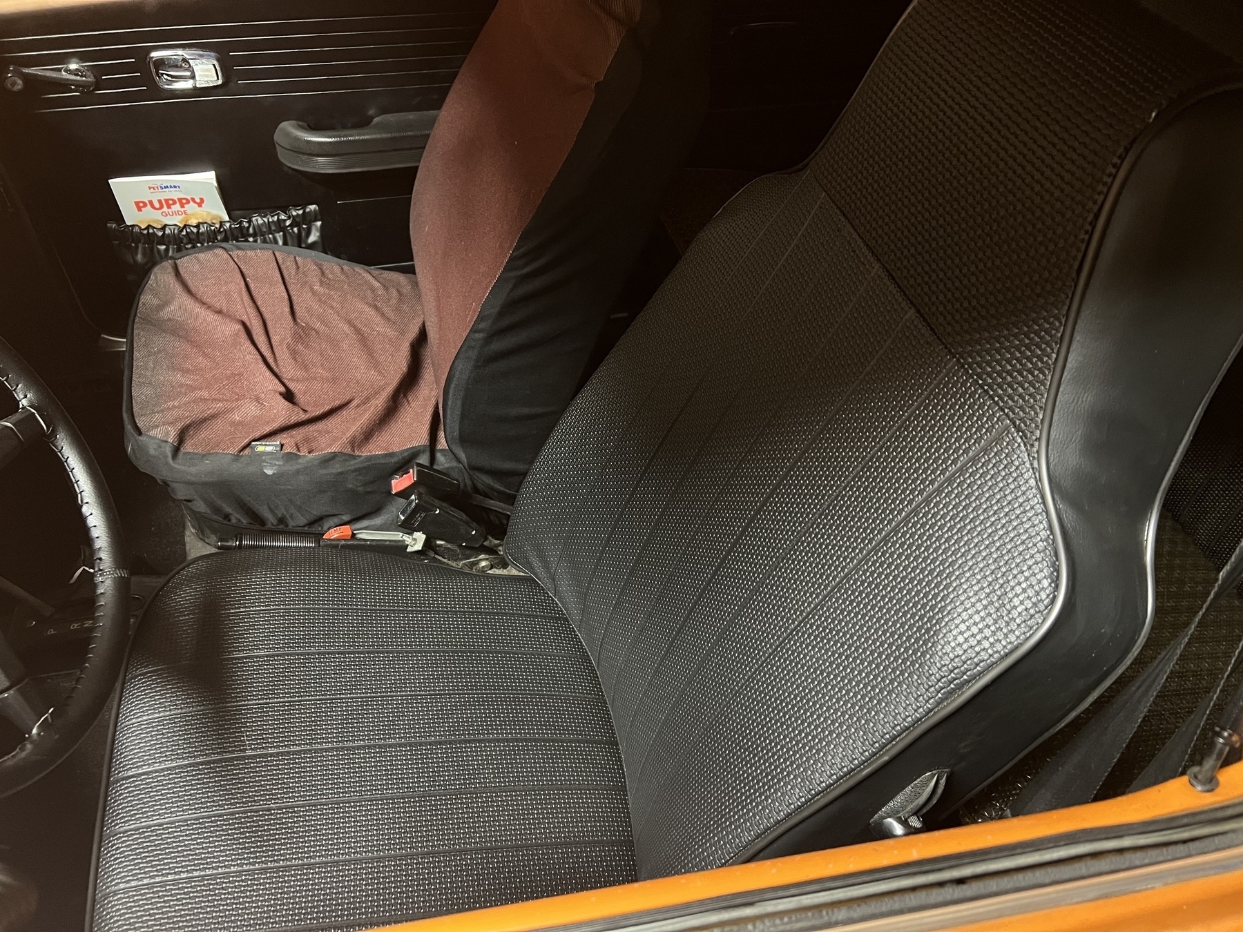 Orange car interior with black seats.&10;