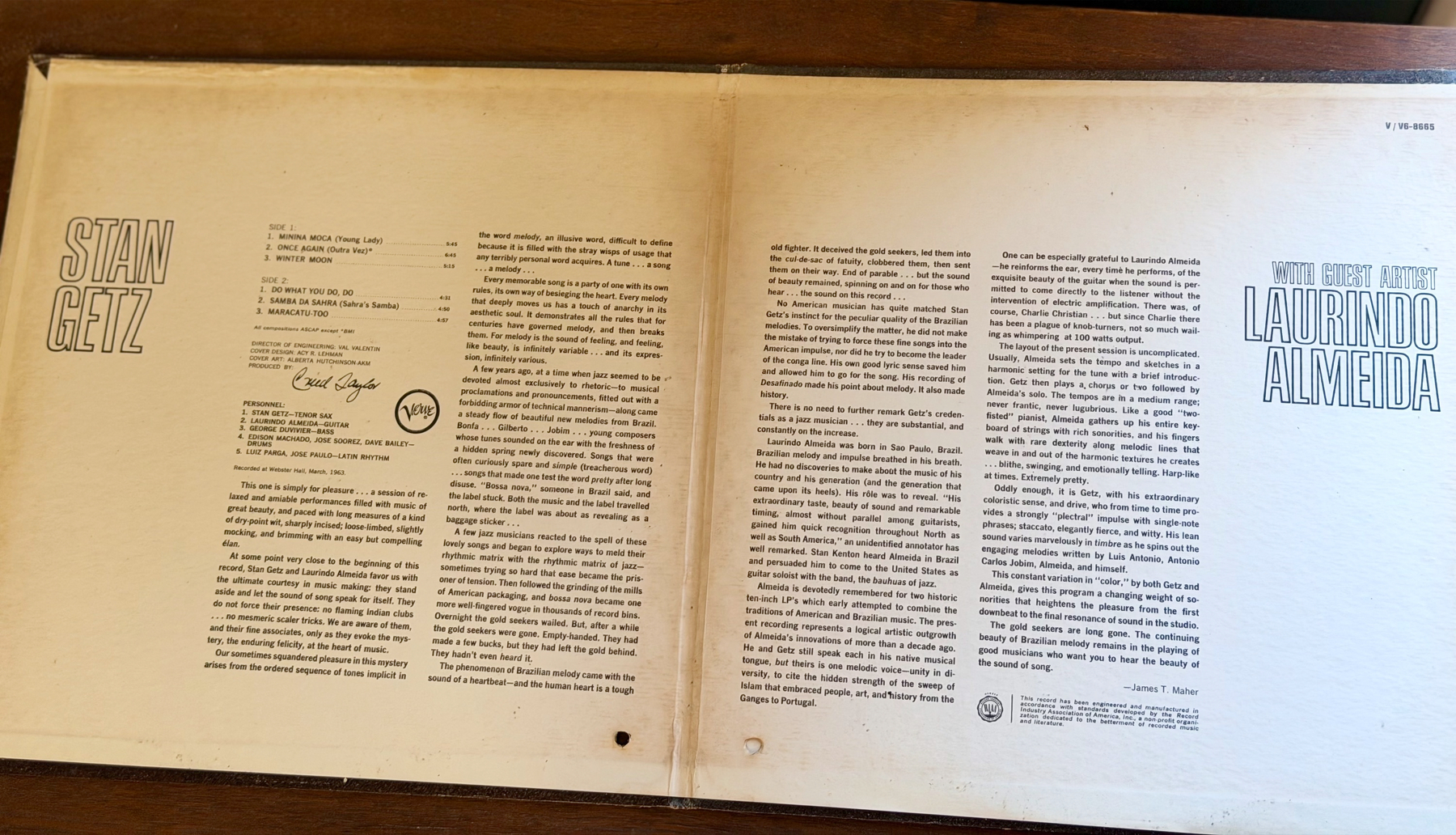 A vinyl record cover features a detailed text introduction to Stan Getz on the left page and Laurindo Almeida on the right page, framed within a simple beige background.