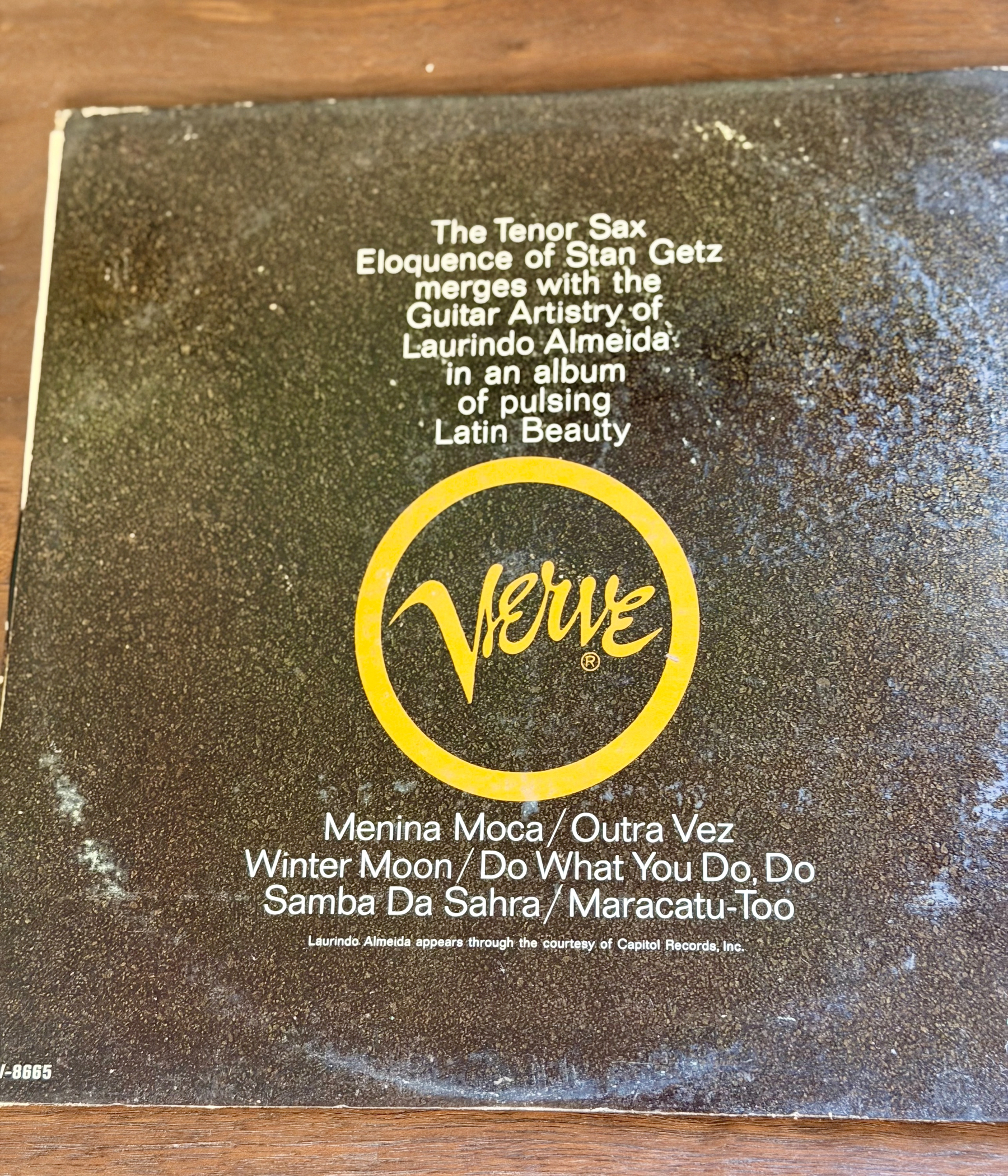 The back cover of a Verve record album features a description highlighting the collaboration between tenor saxophonist Stan Getz and guitarist Laurindo Almeida, along with a list of songs including Menina Moca, Outro Vez, Winter Moon, Do What You Do, Do, Samba Da Sahra, and Maracatu-Too.