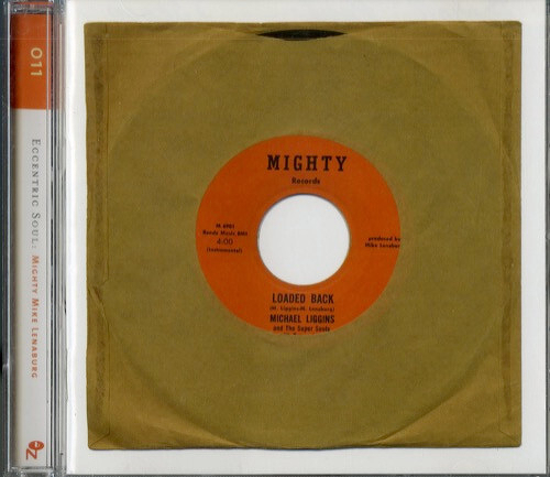 CD Case which looks like the picture of a vinyl 45 record titled Loaded Back by Michael Liggins and The Super Souls is displayed in a brown paper sleeve inside a clear plastic case labeled Eccentric Soul: Mighty Mike Lenaburg.