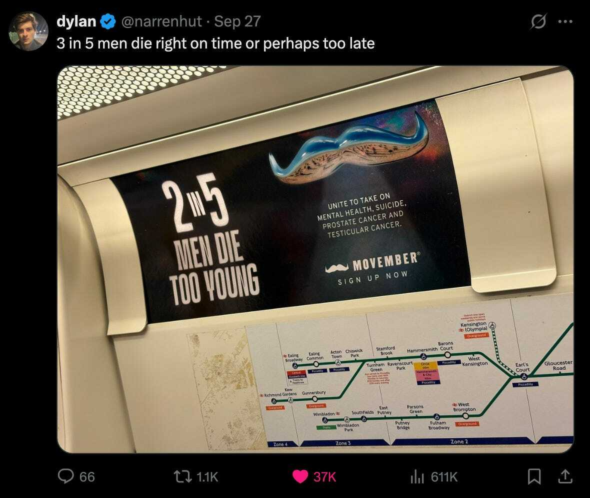 Auto-generated description: A poster about men's health awareness with a mustache graphic is displayed above a public transport map.