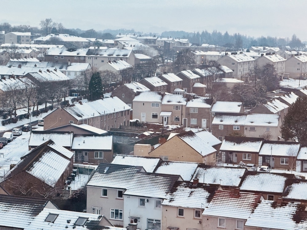 View across snowy rooftops.