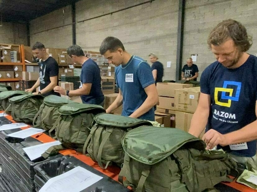 Volunteers are packing a packages for Ukrainian military. 