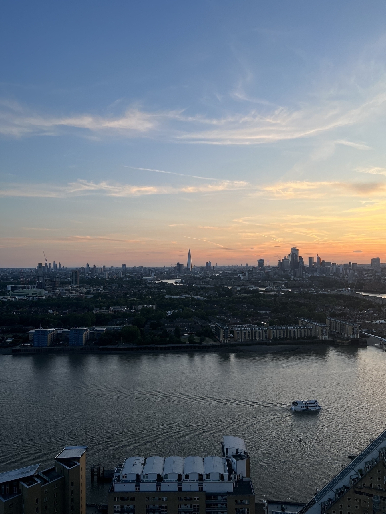 A view of the river Thames and London looking west, catching the edge of a sunset.  