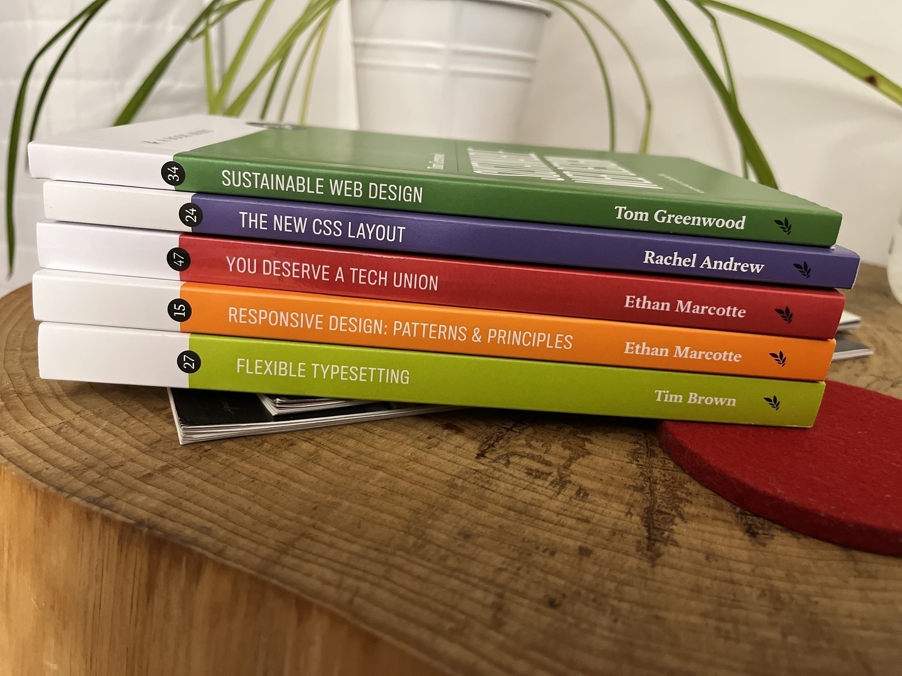 5 book apart books stacked on each other. Sustainable web design by Tom greenwood. The new css layout by Rachel Andrew. You deserve a tech union by Ethan marcotte. Responsive design patterns and principles by Ethan marcotte. Flexible typesetting by Tim brown. 