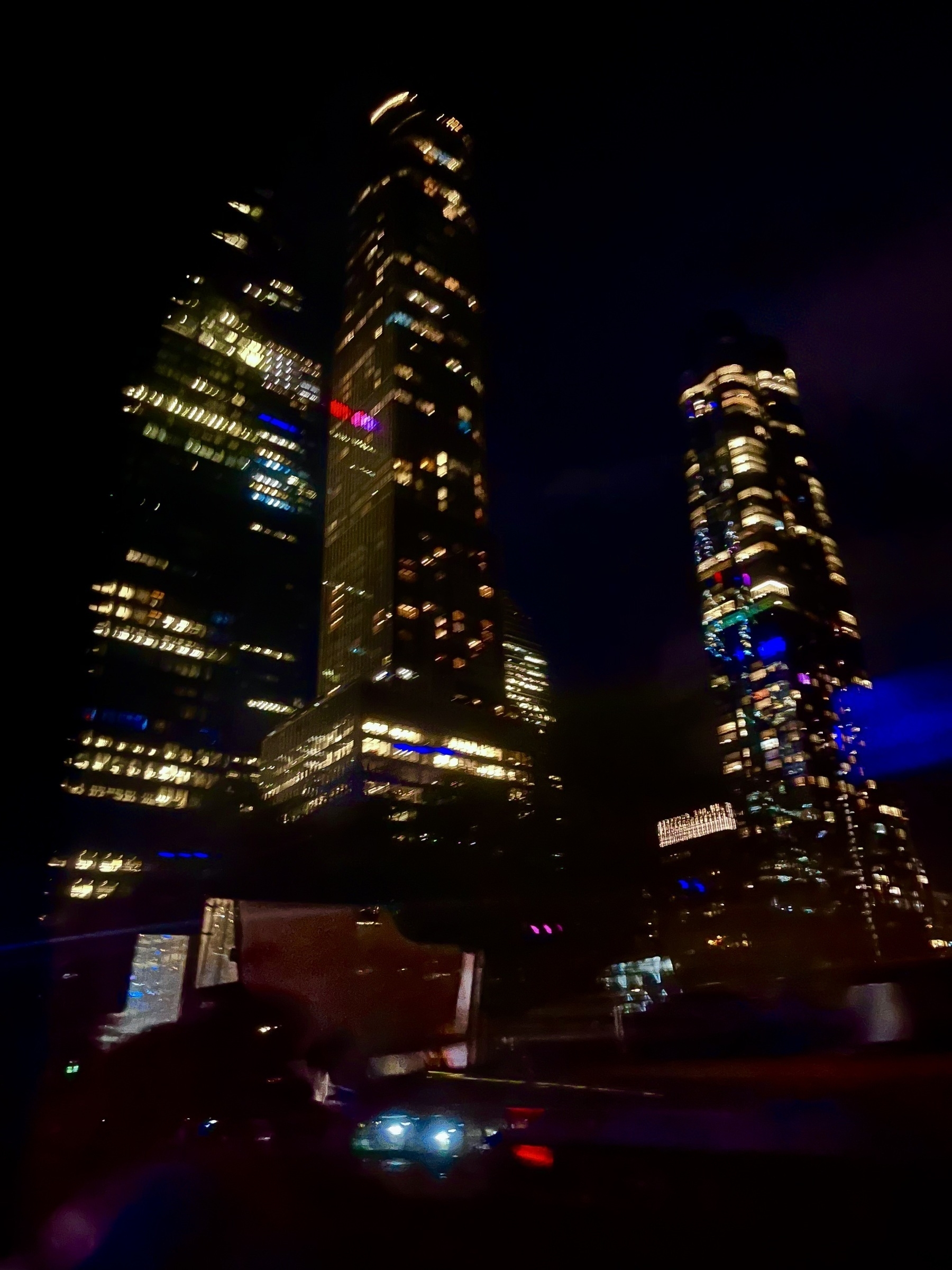 A night show of glowing New York City skyscrapers 