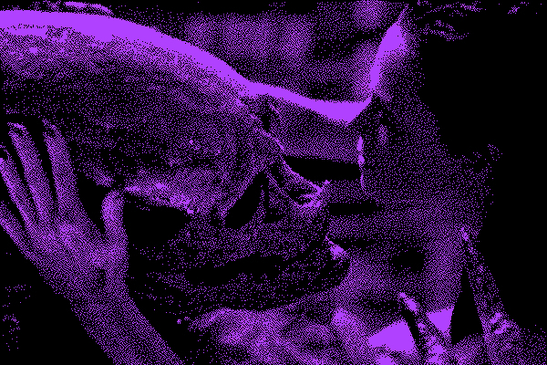 Grainy black and purple photo of Ripley, a white woman, holding the alien&#39;s head lovingly.