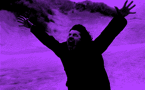 Grainy black and purple photo of a white man screaming, eyes squeezed close, arms raised, running on a beach.