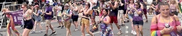 A long wide shot of LGBTQ+ parade marching band.