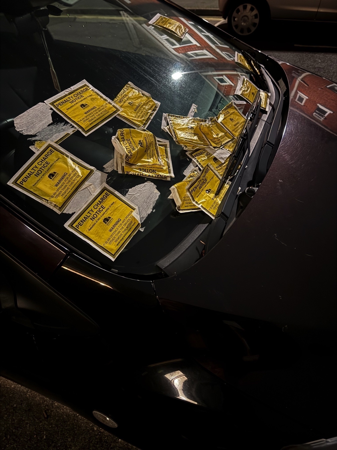 Image of car windscreen covered in parking fine notices in Southampton