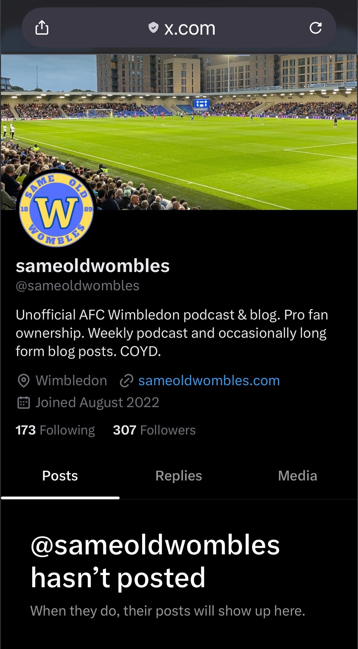 An unofficial AFC Wimbledon podcast and blog account on X.com features a profile with a header image of a crowded football stadium.