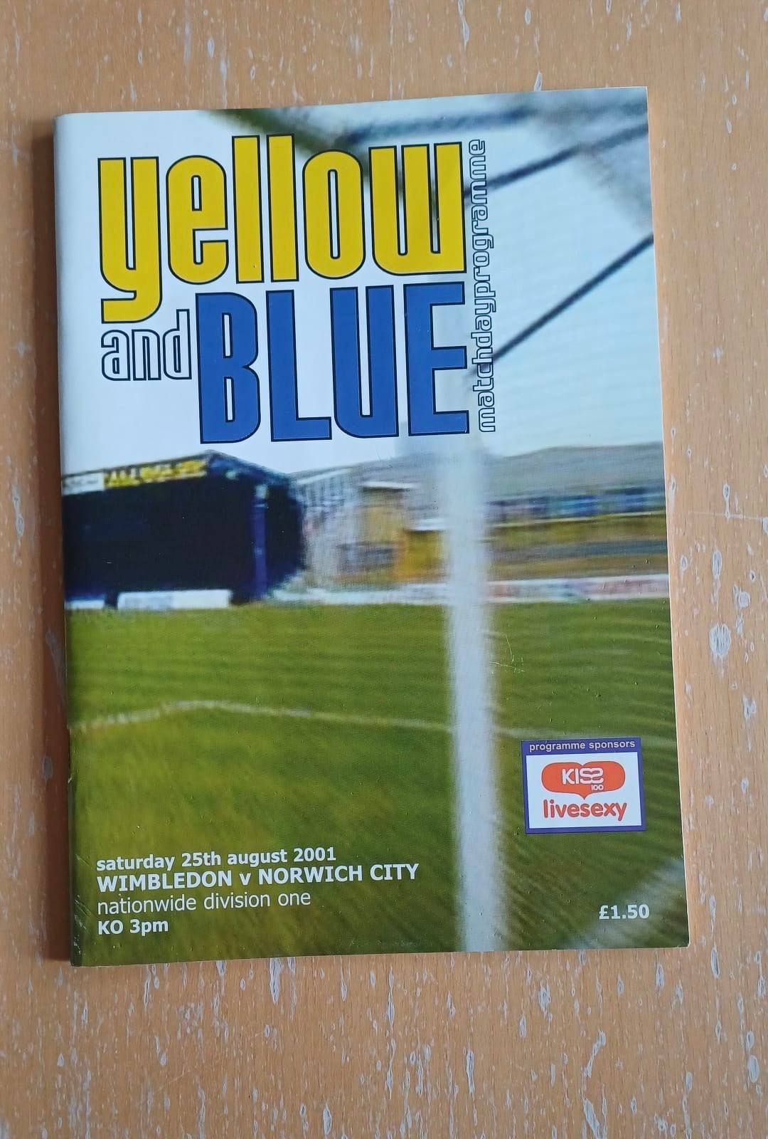 A football matchday programme titled Yellow and Blue for the Wimbledon vs Norwich City game held on Saturday, 25th August 2001, is shown.