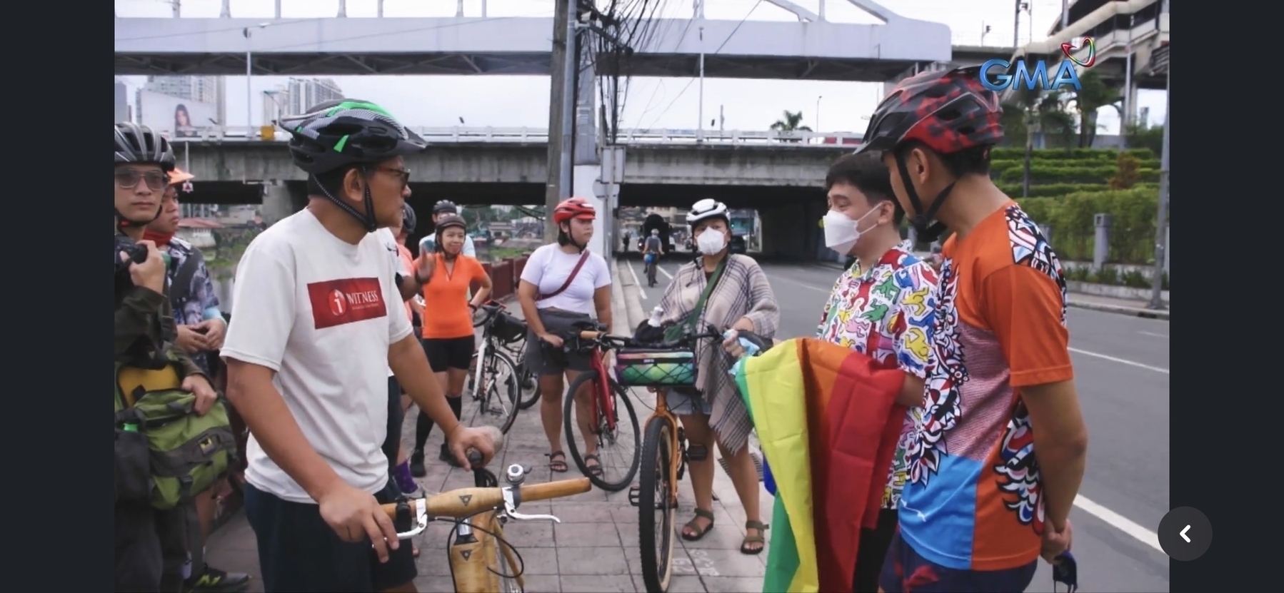 snippet from the I-Witness documentary, entitled Trip to Pasig, where Chi is seen wearing her signature red helmet and white crop top shirt and gray shorts standing right by the side of Pasig River with other bike commuters, prepping for their ride to Manila Boat Club. Seen on the left side wearing a black helmet and white shirt with the red I-Witness logo is Howie Severino, the documentary’s narrator and who the camera was focused to.