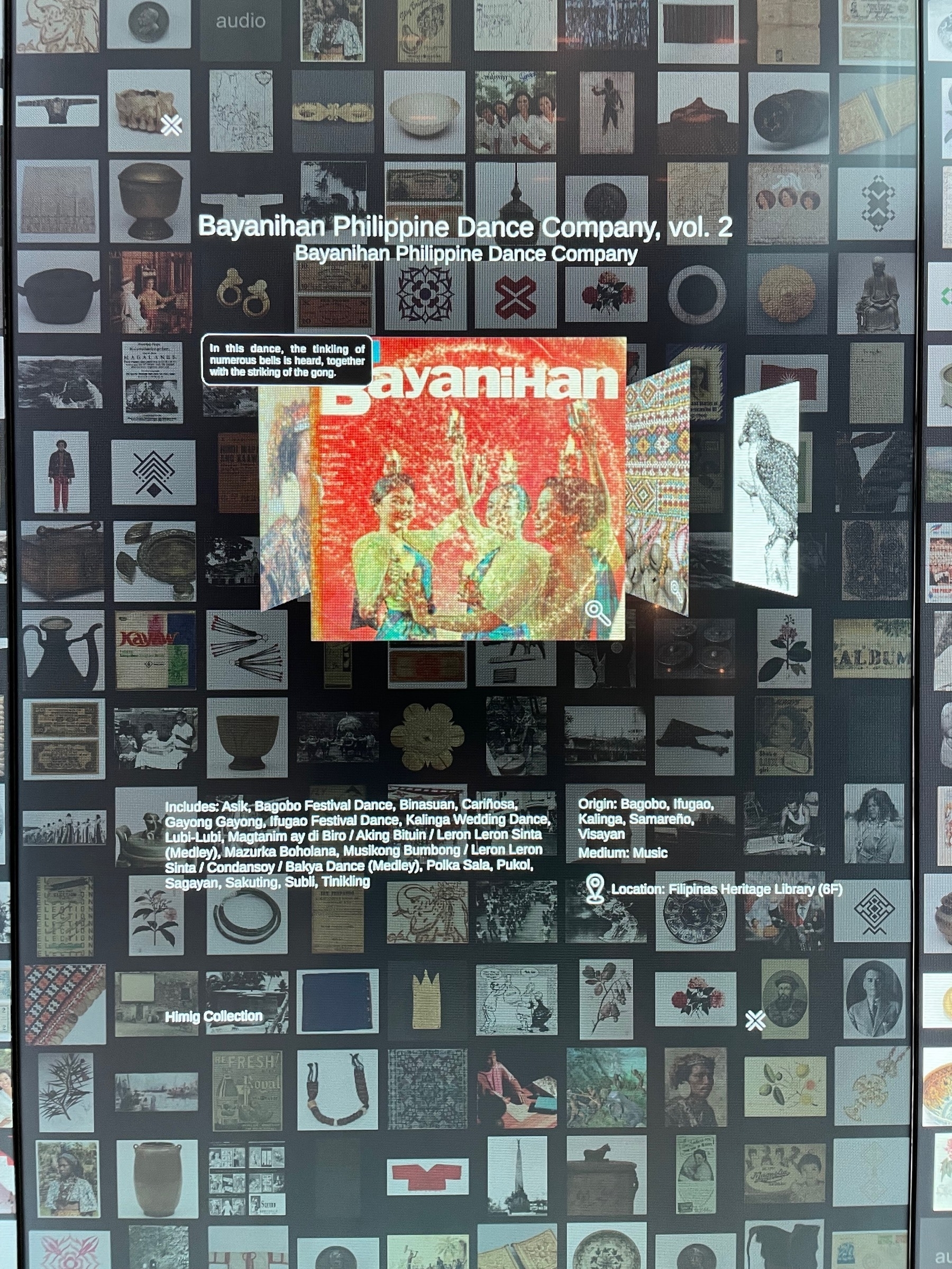 Digital interface at the Ayala Museum showing a grid of the different items collected and displayed at the museum. The item currently selected is the Bayanihan Philippine Dance Company, vol. 2 music CD. It is located in the Filipinas Heritage Library at the 6th floor as part of the Himig Collection.