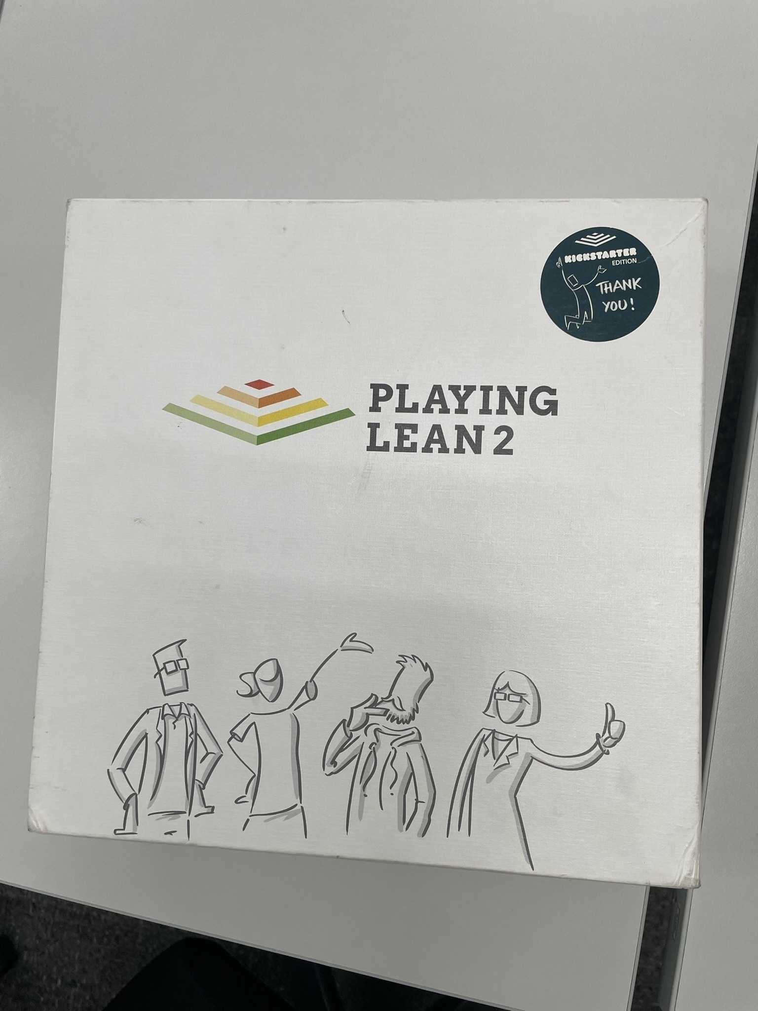 Playing Lean 2: Kickstarter edition board game box cover.