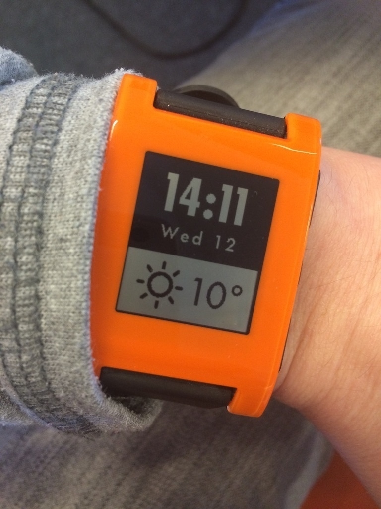 orange e-ink smartwatch on my wrist