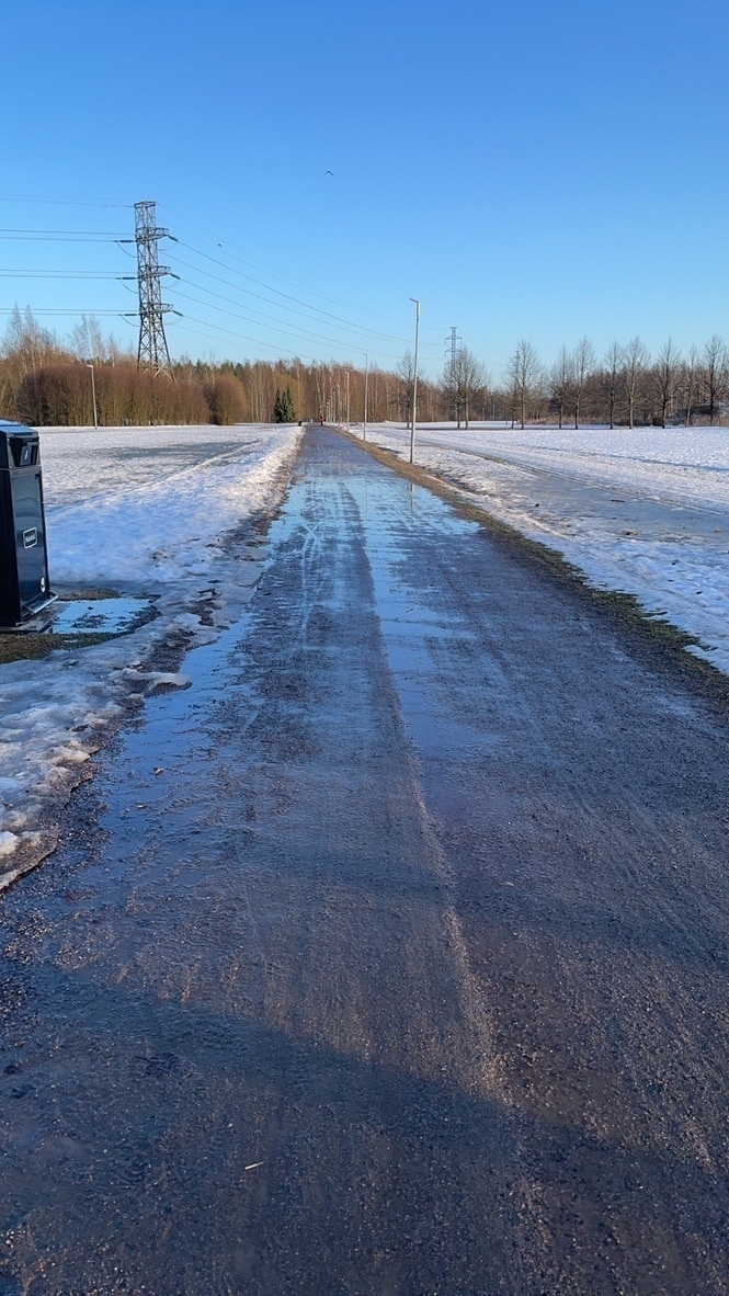 muddy bike track, snow on the sides