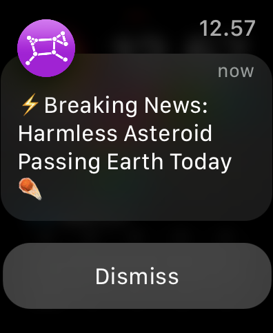 notification on a watch screen stating: "Breaking News: Harmless Asteroid Passing Earth Today"