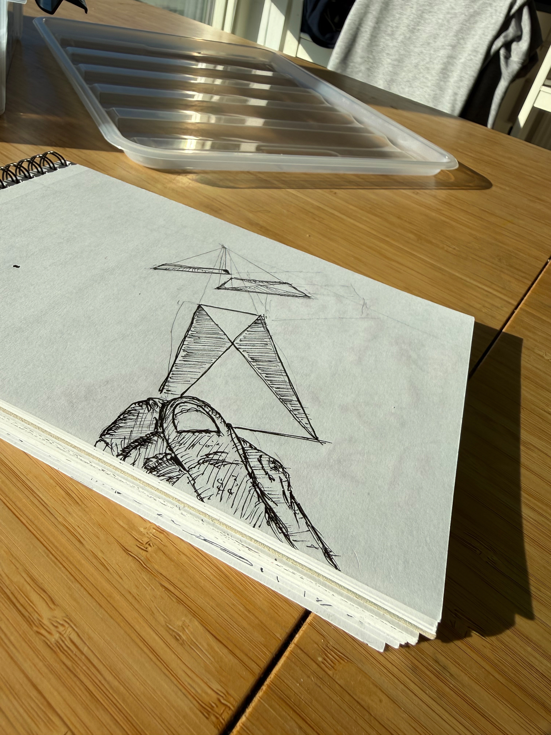Draft book. Ink drawing with underlying pencil support lines showing&10;&10;Thumb and other fingers dealing a card towards the horizon. Two other cards already flying through space
