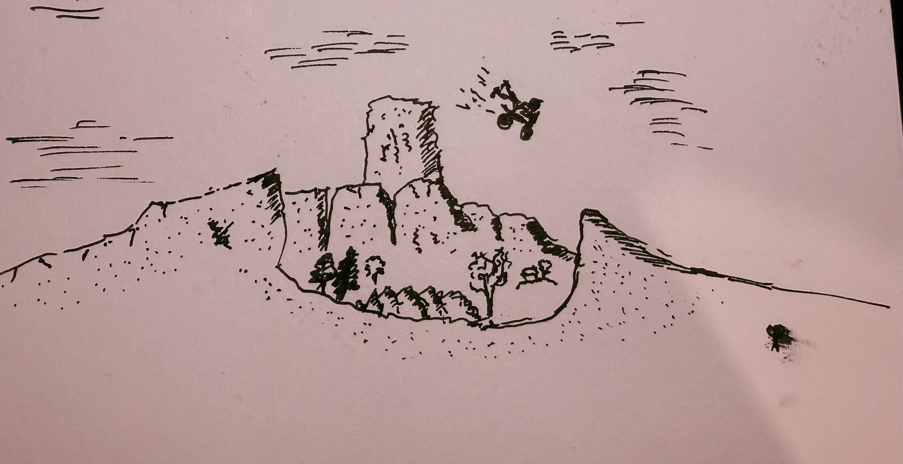 A person flying with a motorcycle over a gorge extremely recklessly