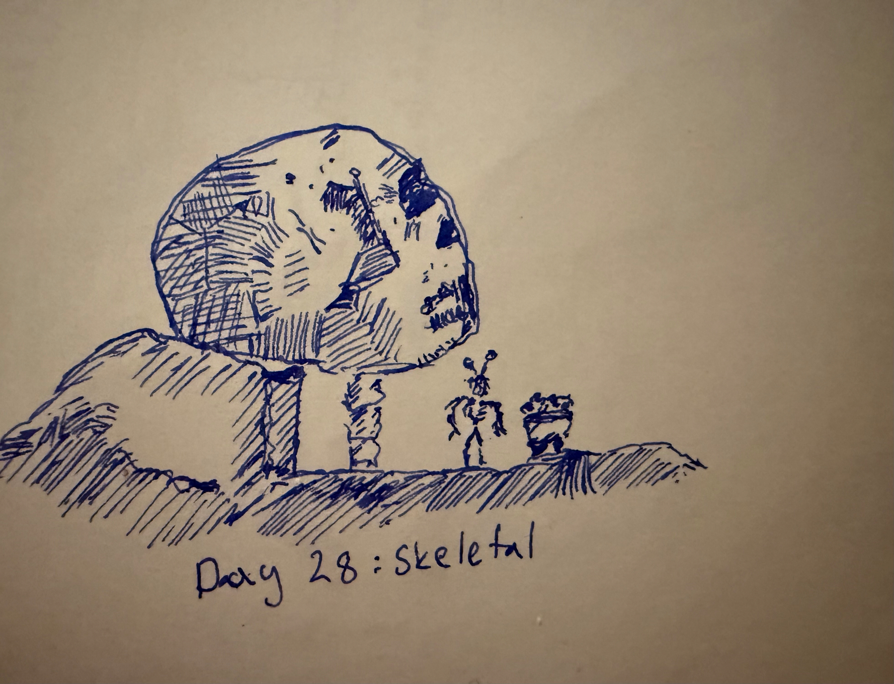 There is giant rock or is it a giant skull on top of a bed rock and three smaller rocks that look a bit like vertebrae. A humanoid shape robot is collecting something to its mining cart