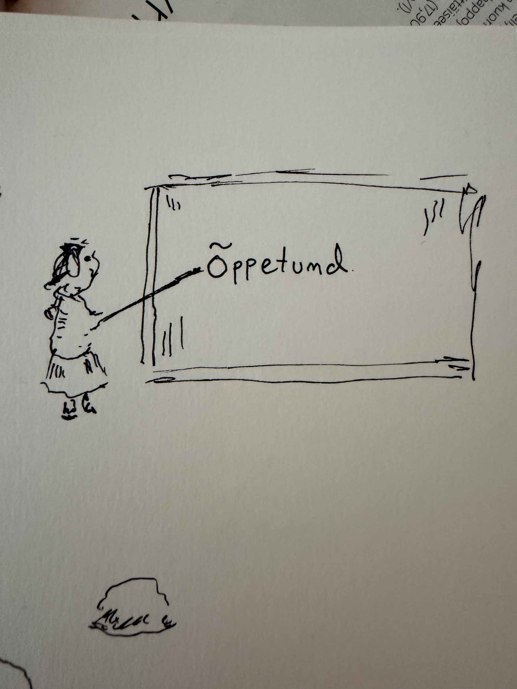 Person in a dress pointing at a whiteboard. There is a word ”õppetund” on the board. Õppentund is Estonian for ”a lesson”