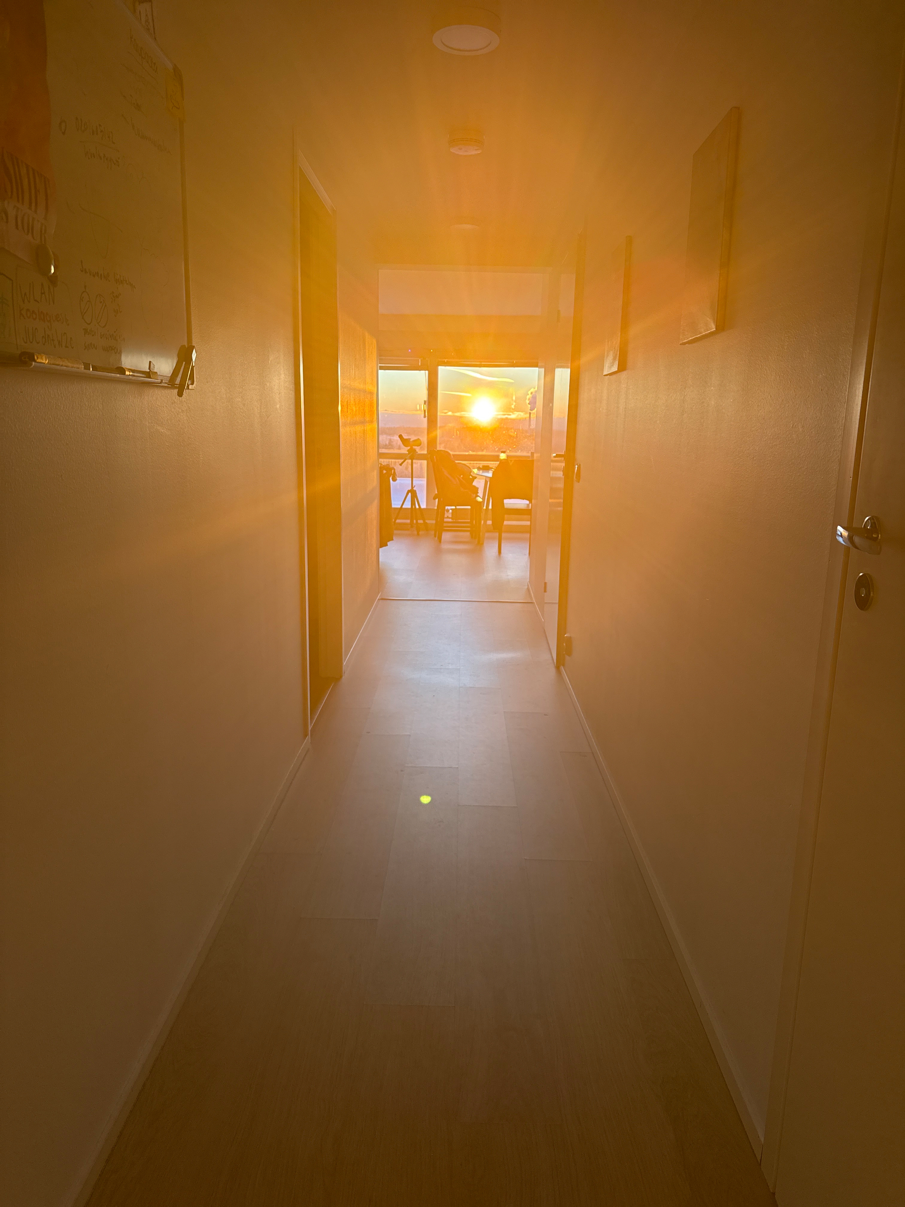View of the setting sun through a corridor and my home. Light overwhelming everything with its love