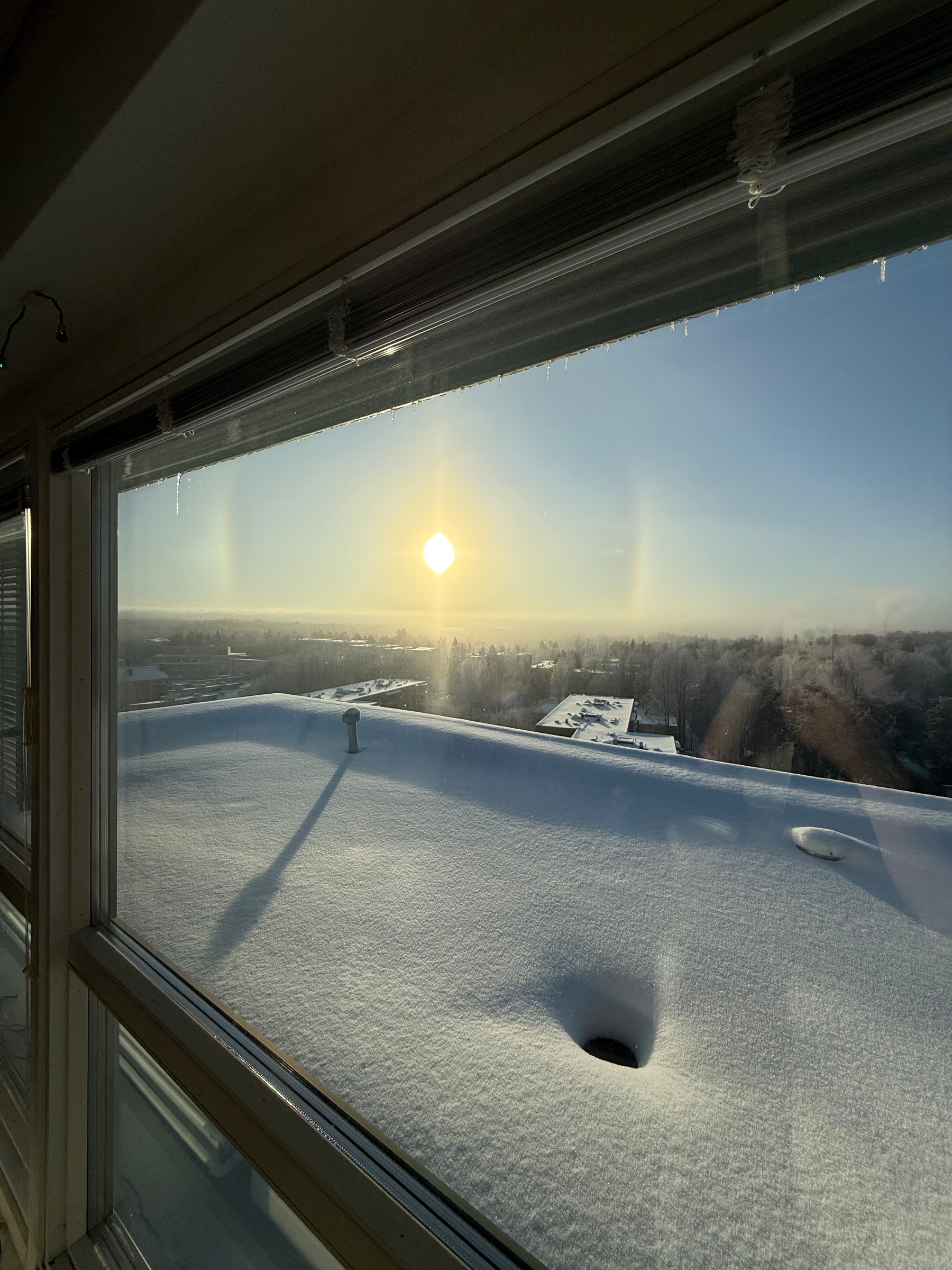 Mid-day sun over the Helsinki. Cool halos circling the sun