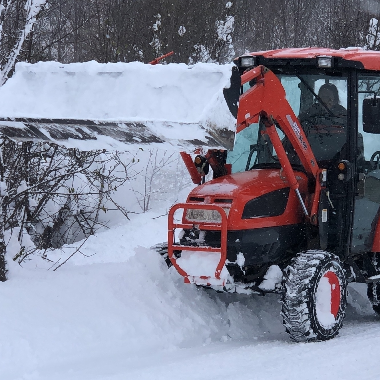tractor with blower in deep snow