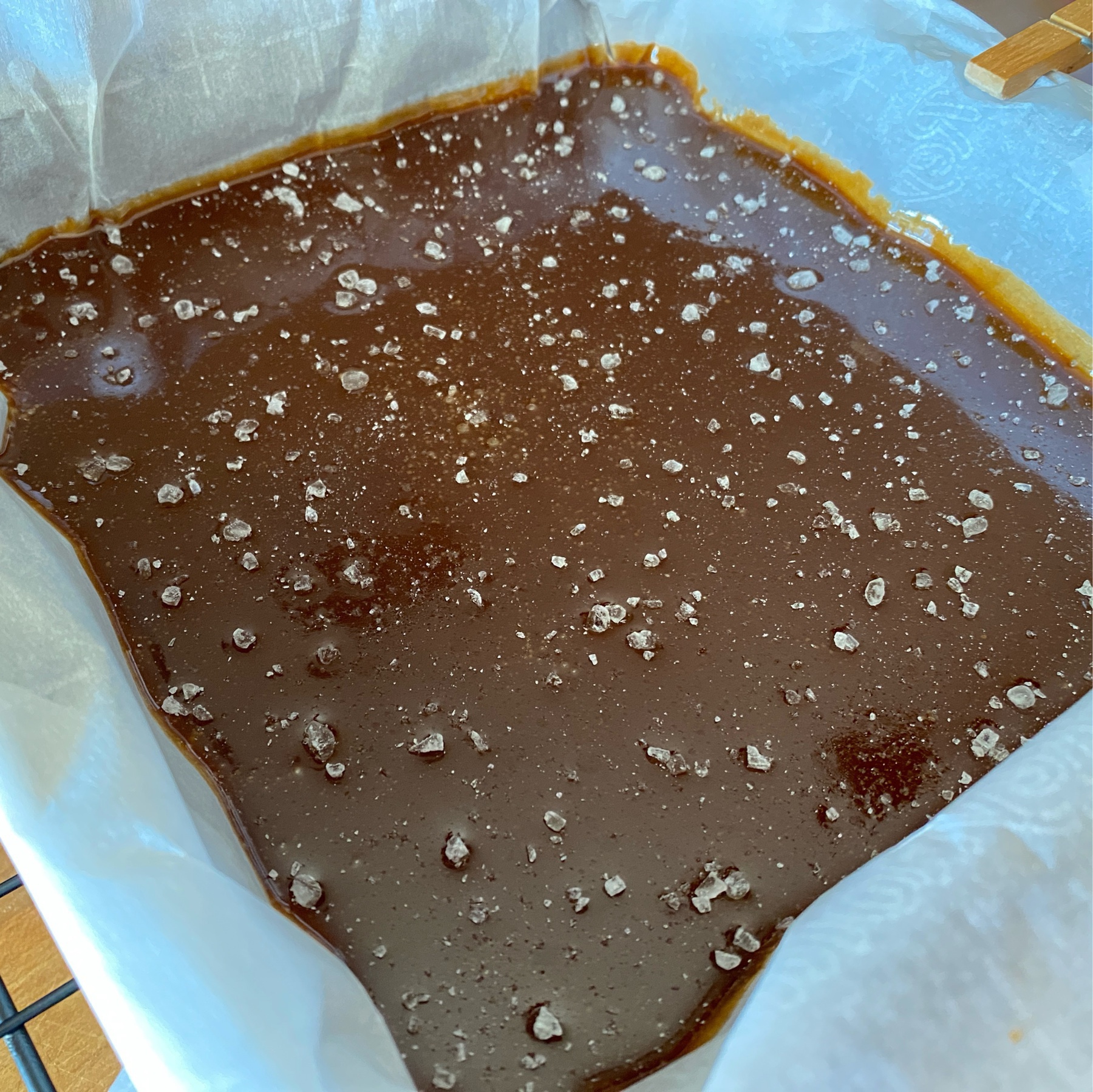coarse salt caramel cooling in a parchment lined pan