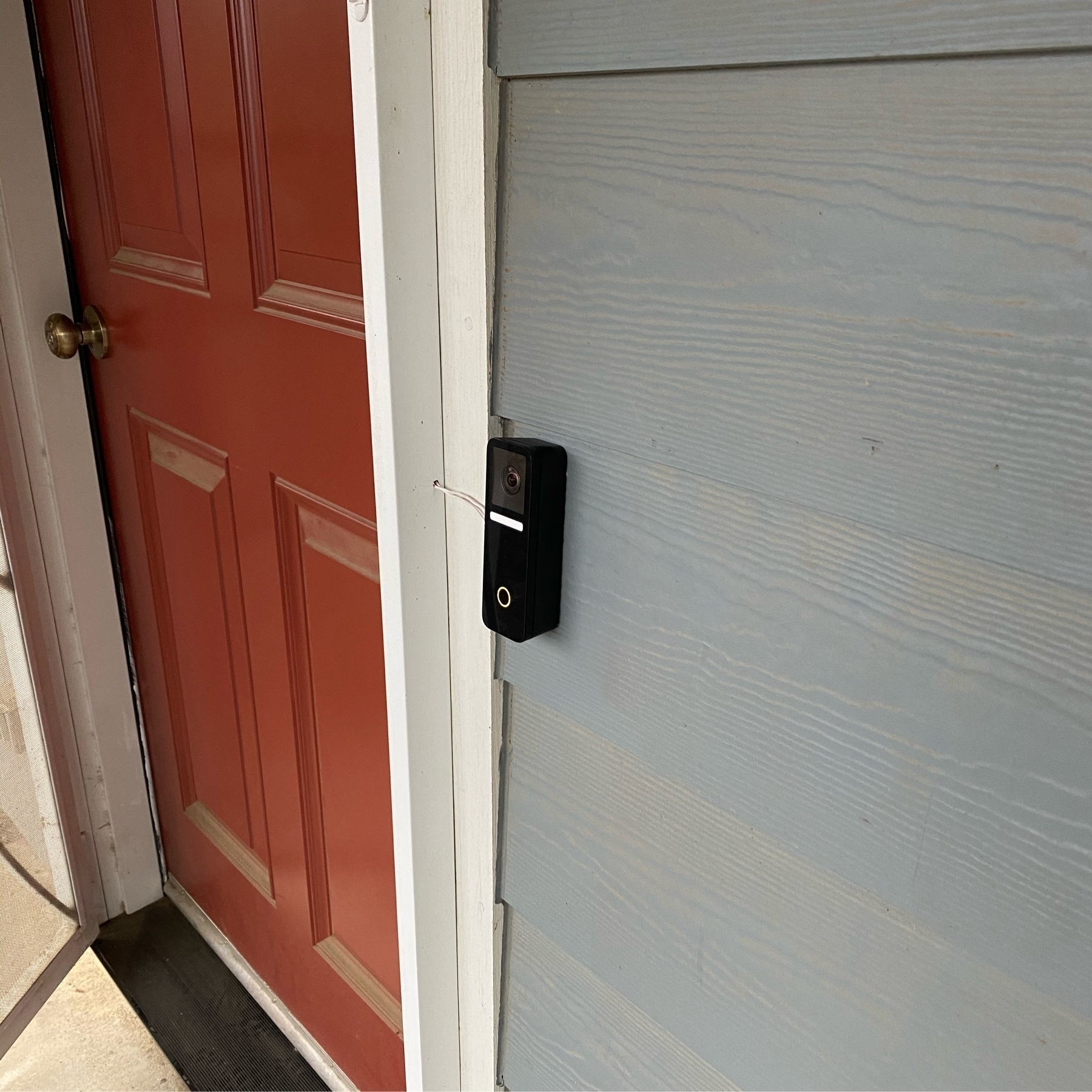 Logitech Circle View doorbell by a red front door
