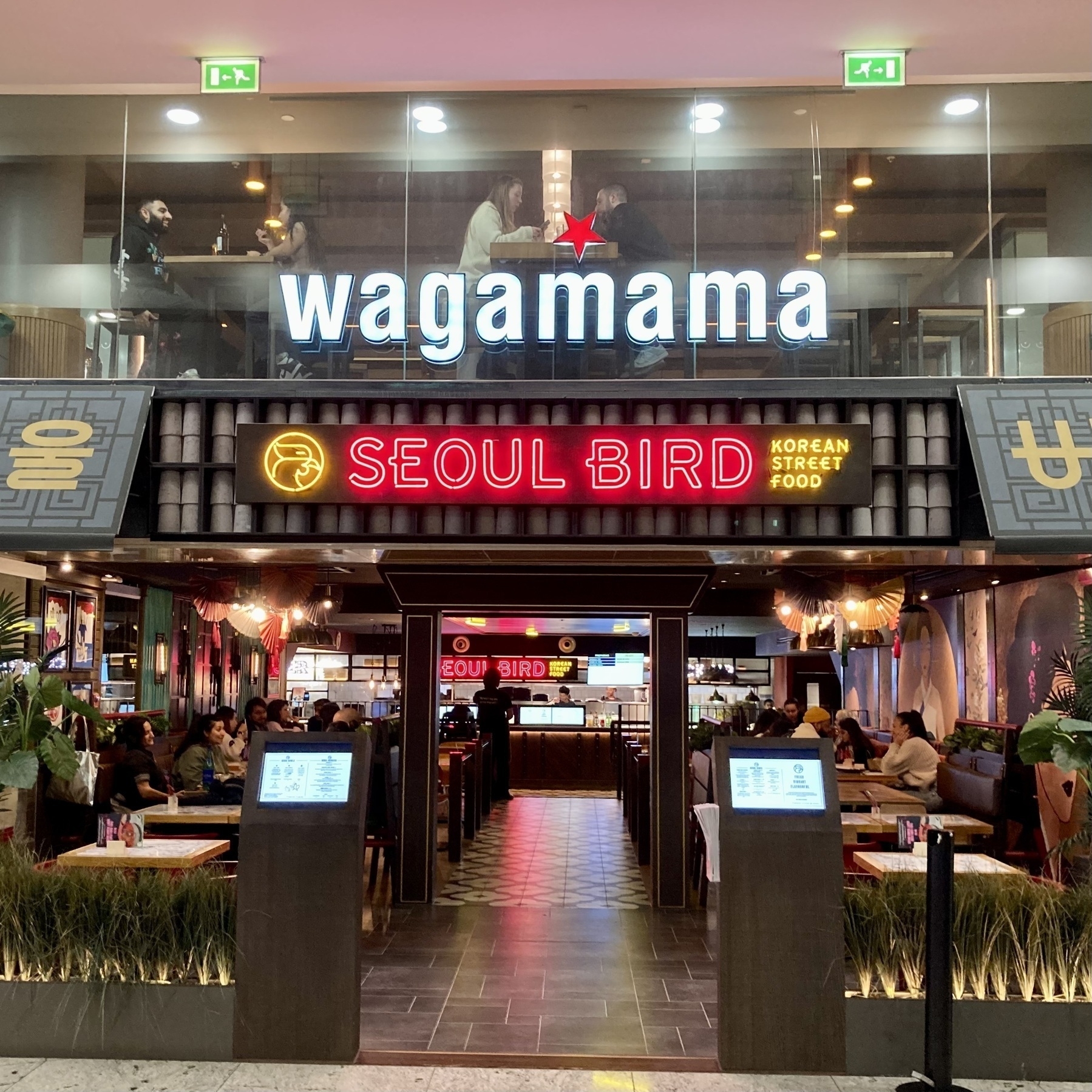 Seoul Bird fried chicken restaurant entrance, Wagamama noodle restaurant above, Jubilee place, Canary Wharf, London