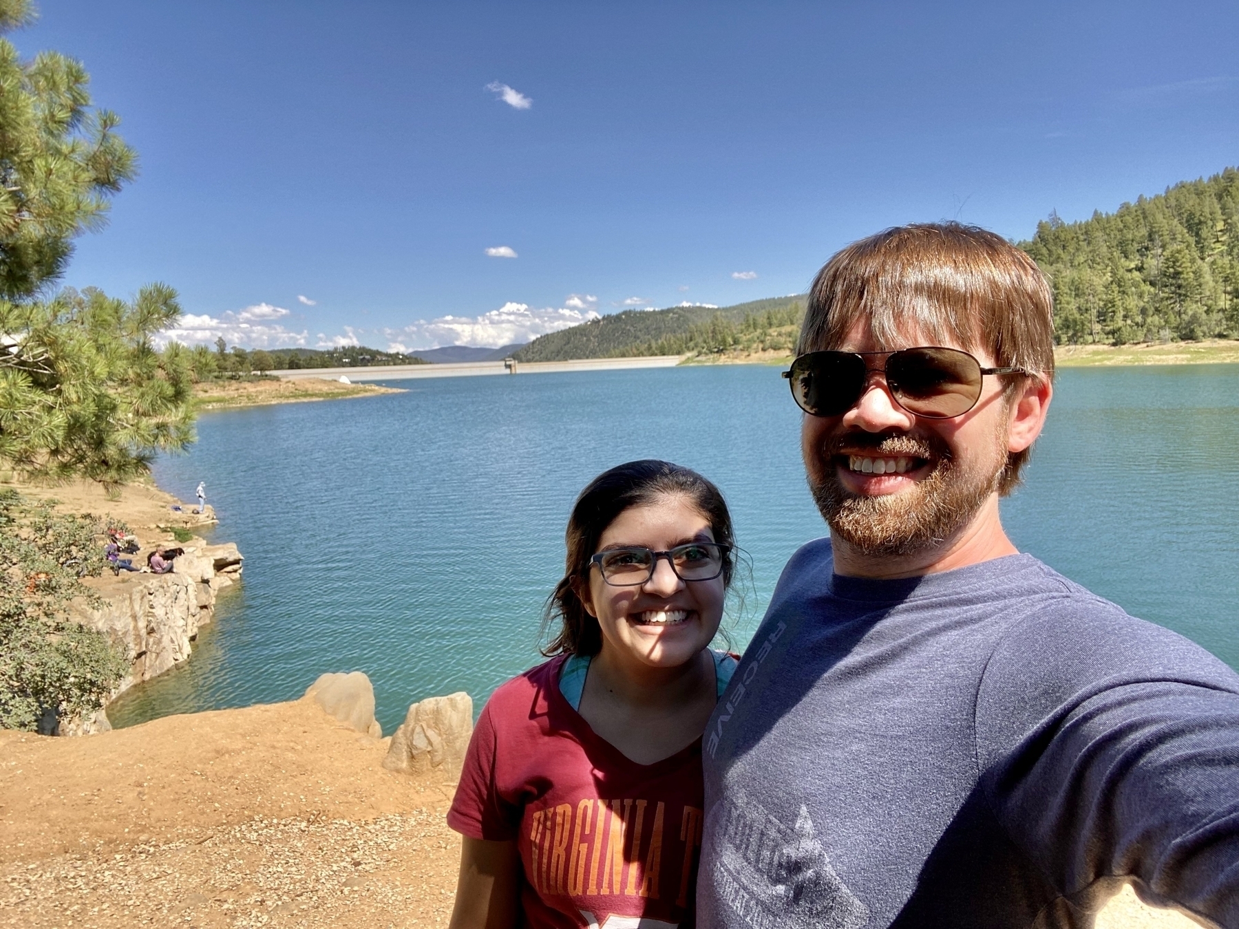 Selfie of my wife and me in front of Grindstone Lake on a very sunny day.
