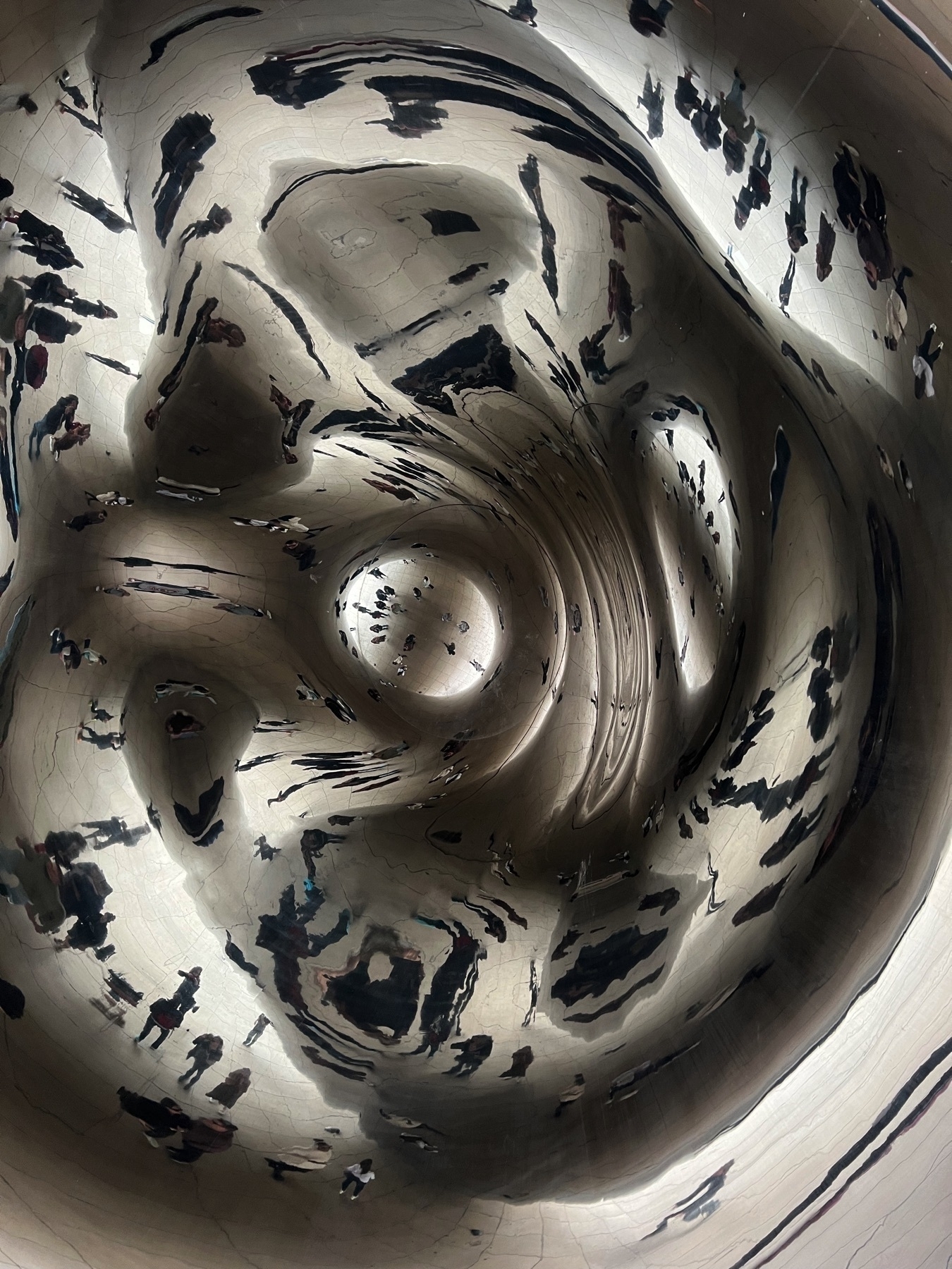 reflective picture from underneath the cloud gate bean in chicago