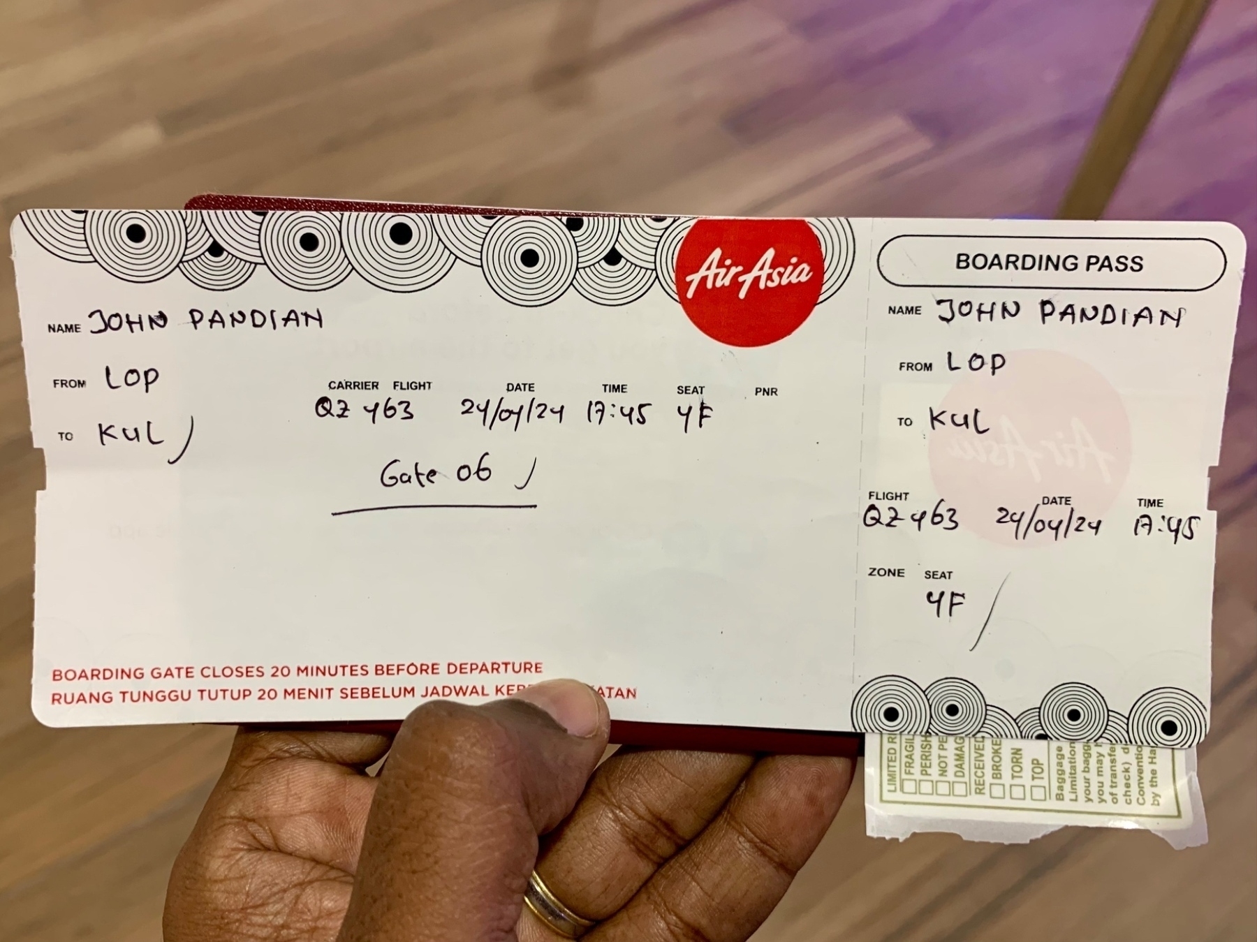 A flight boarding pass with all details written by hand