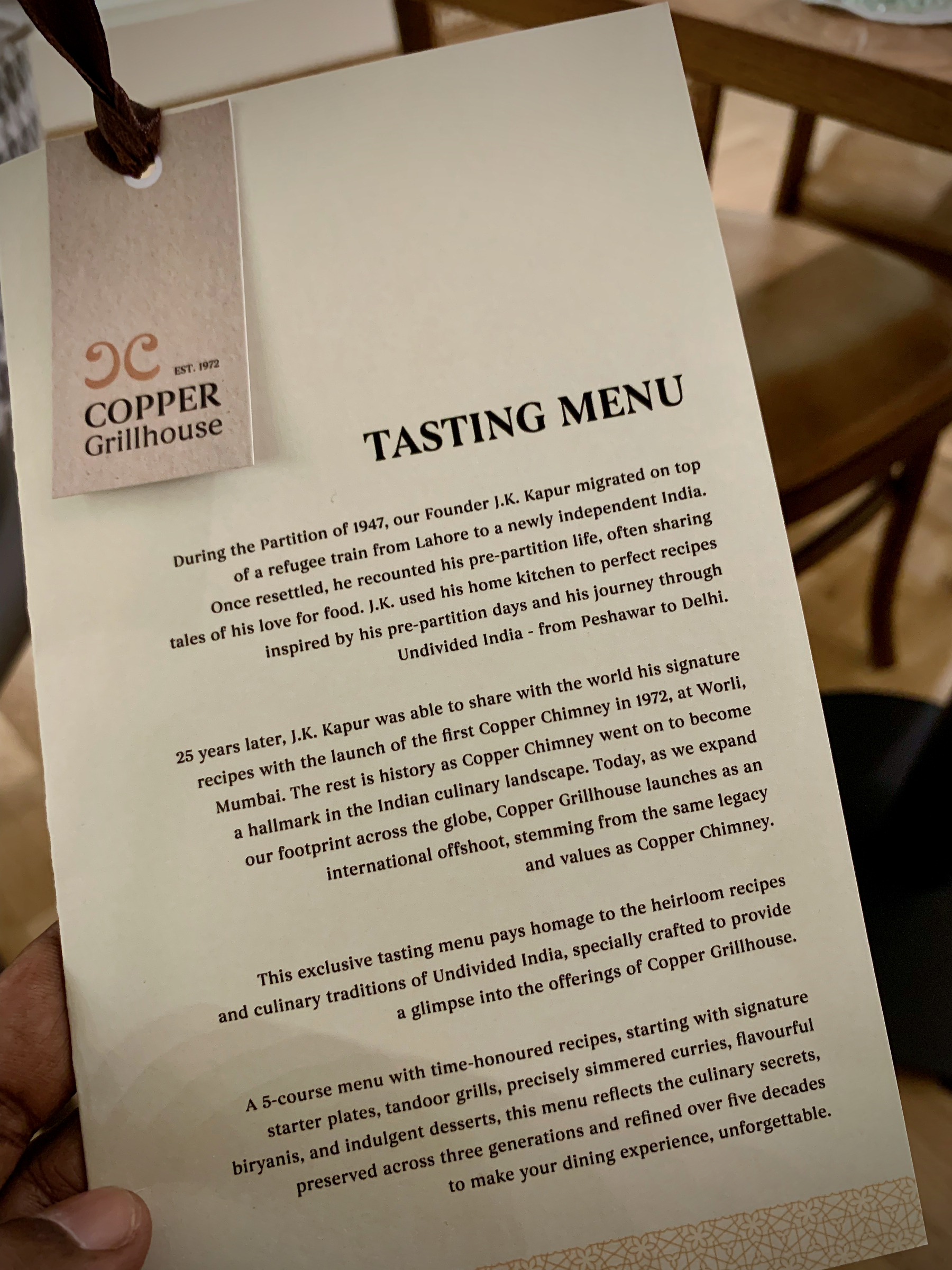 Photo of the first page of the tasting menu of Copper Grillhouse, which gives an overview of the history of the restaurant chain.