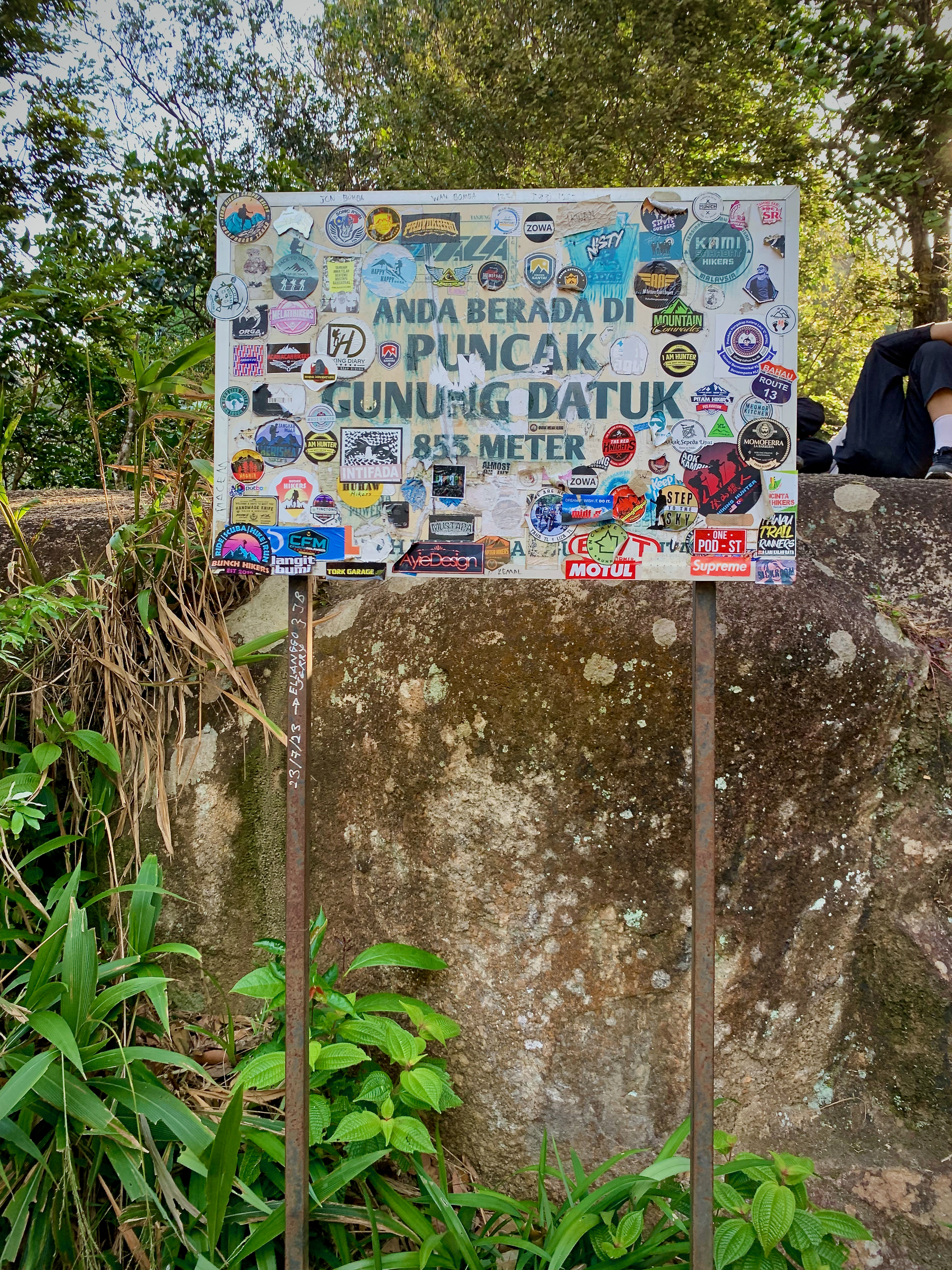 A board at the summit of Gunung Datuk stating that you are there
