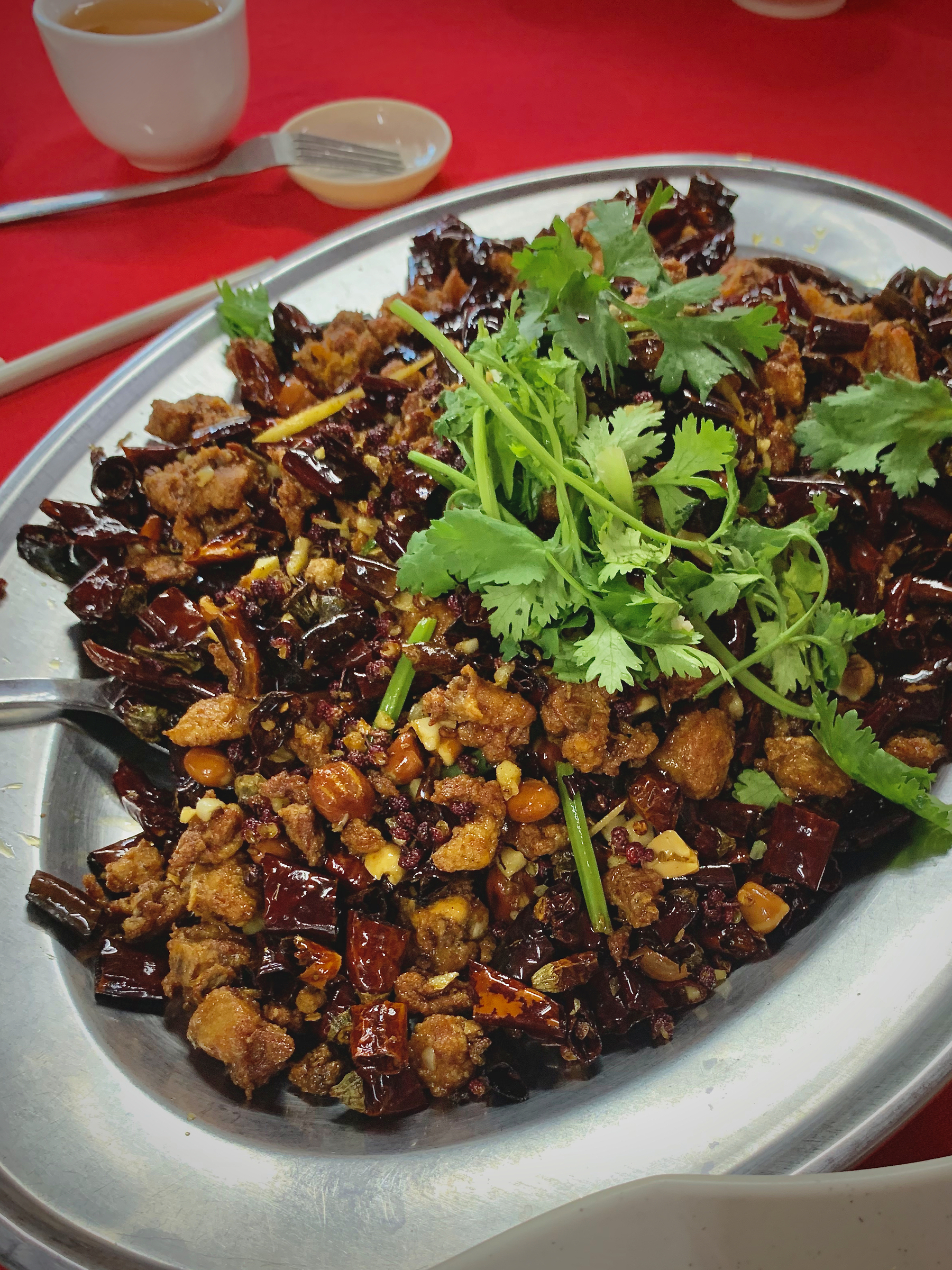 Fried chicken tossed with some dry red chillies and sichuan pepper