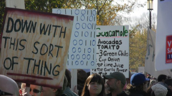 signs from the Rally to Restore Sanity, including one with a guacamole recipe