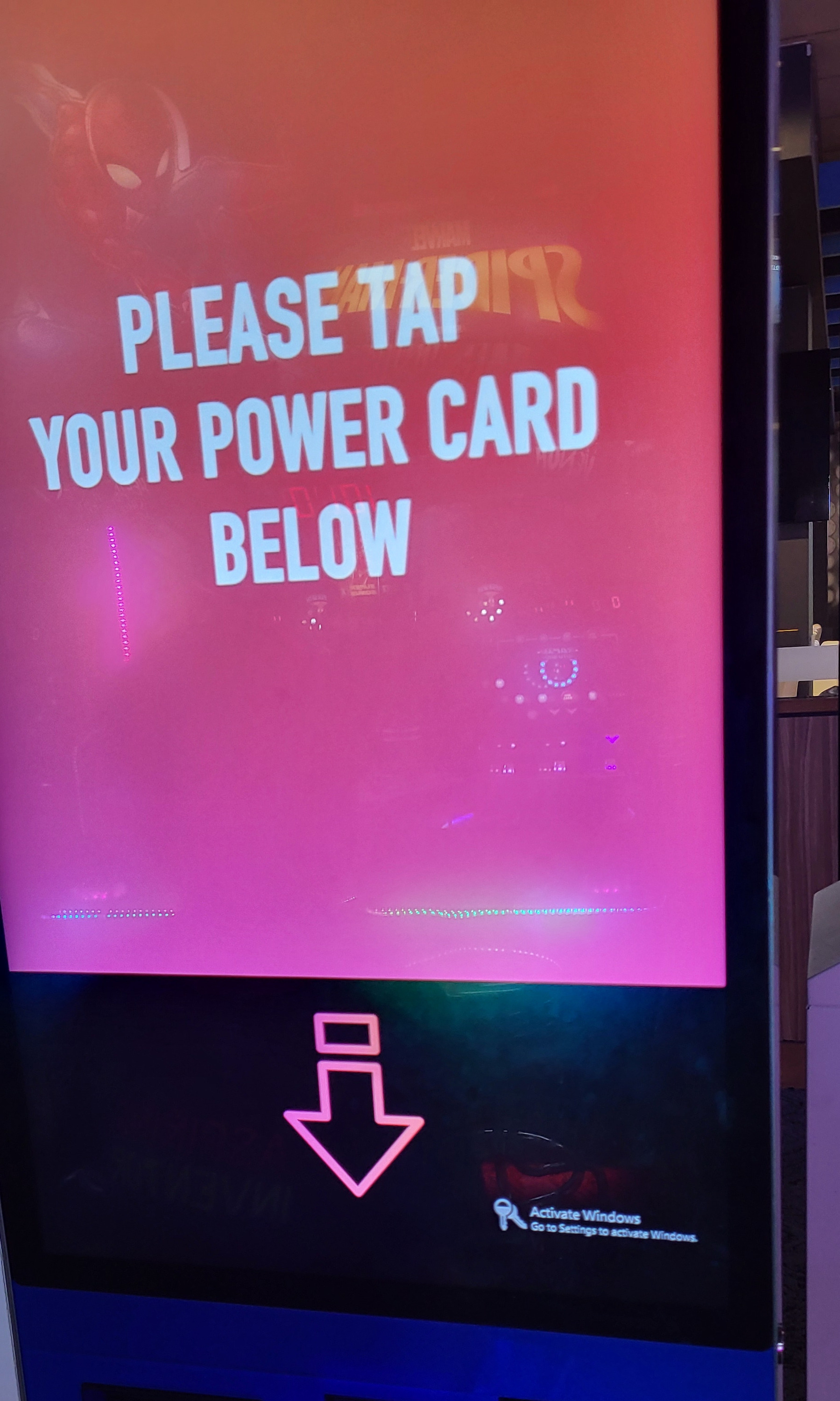 Auto-generated description: A screen prompts users to tap their power card below, with a visible Activate Windows watermark.