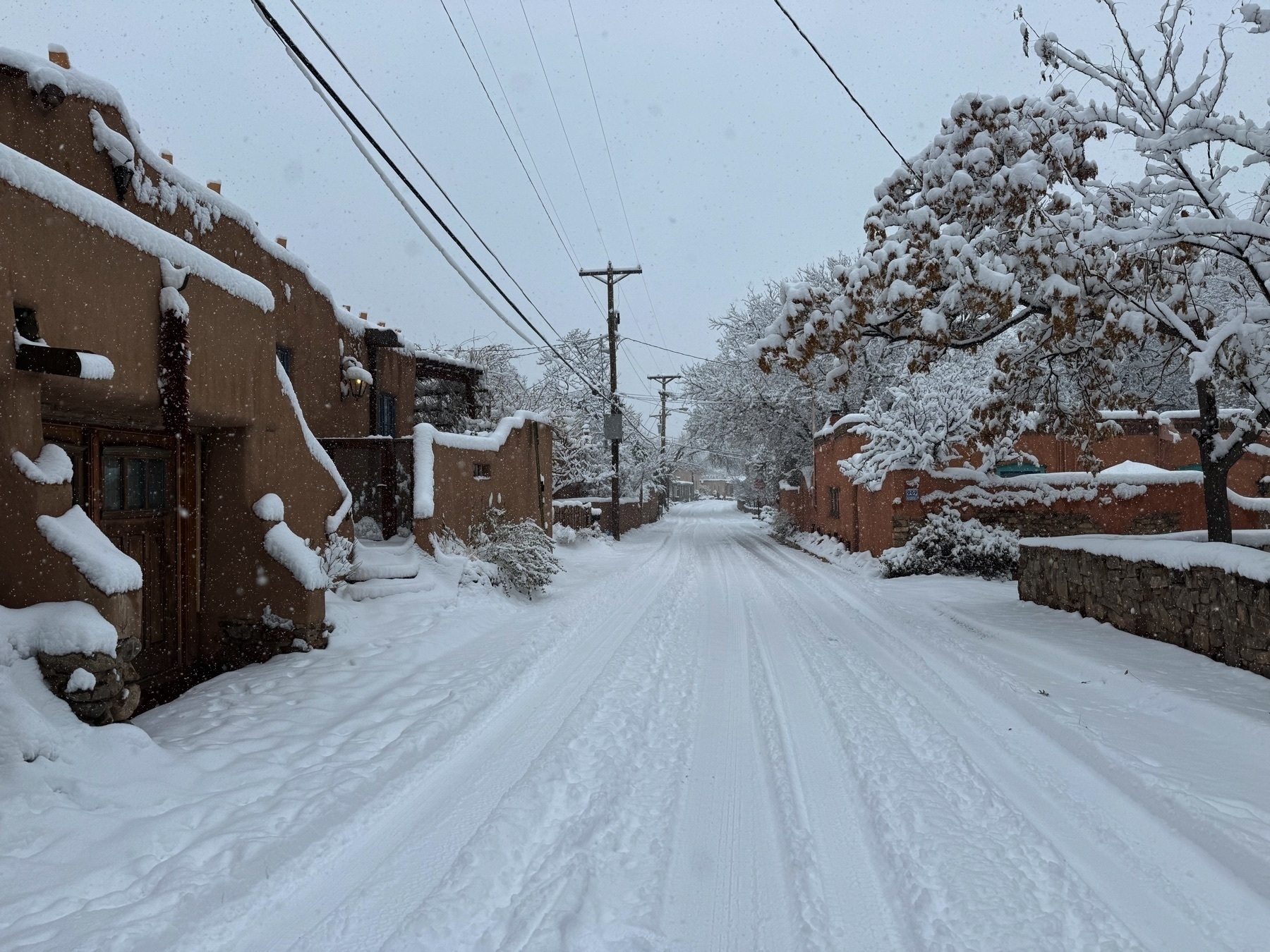 Heavy snow covering everything on Canyon Road in Santa Fe with no people in sight