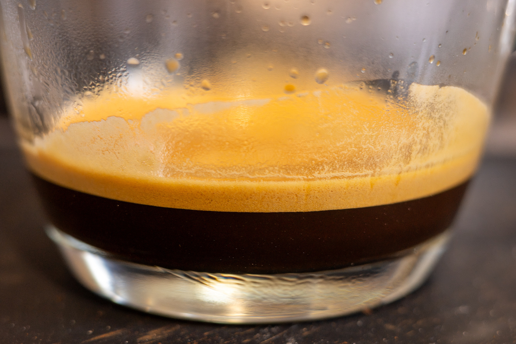 Espresso coffee in a glass mug with a nice layer of crema.