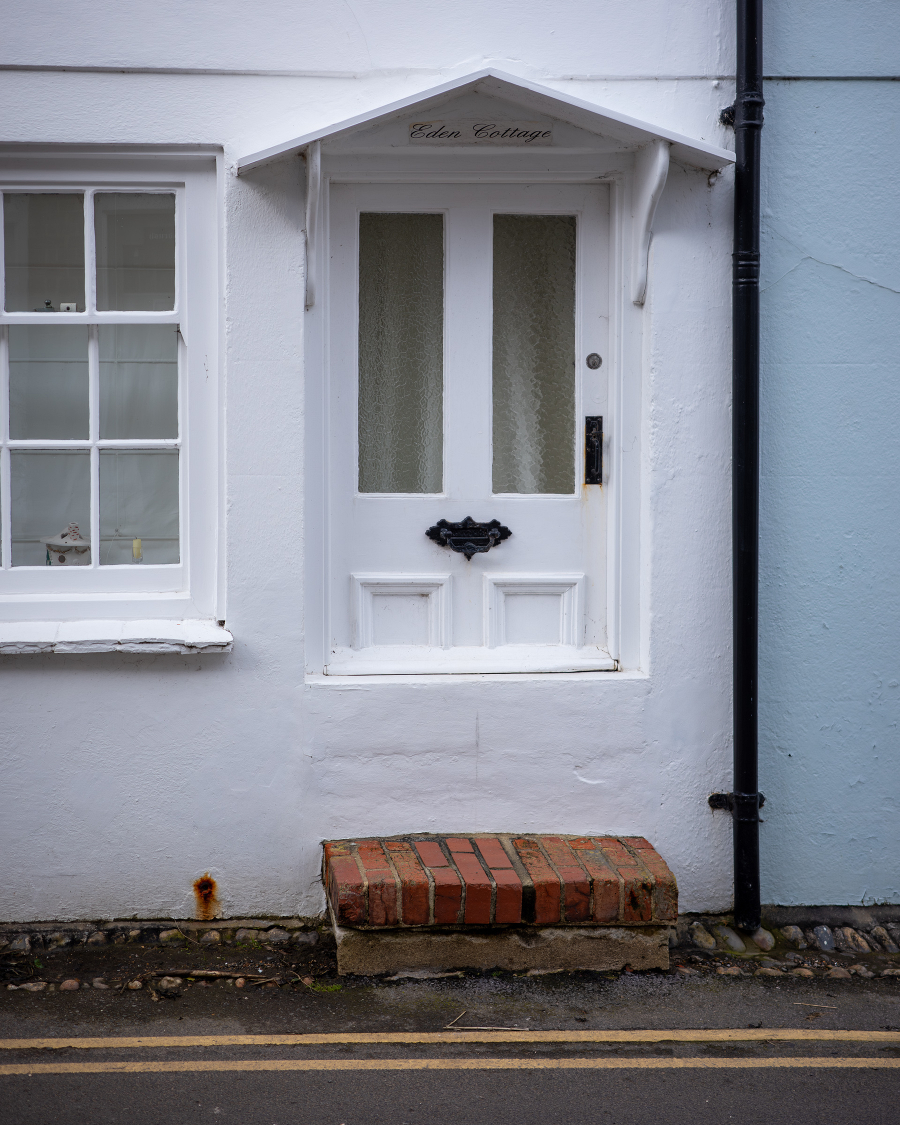 A very short front door with a high entry to prevent tidal waters flooding the house.
